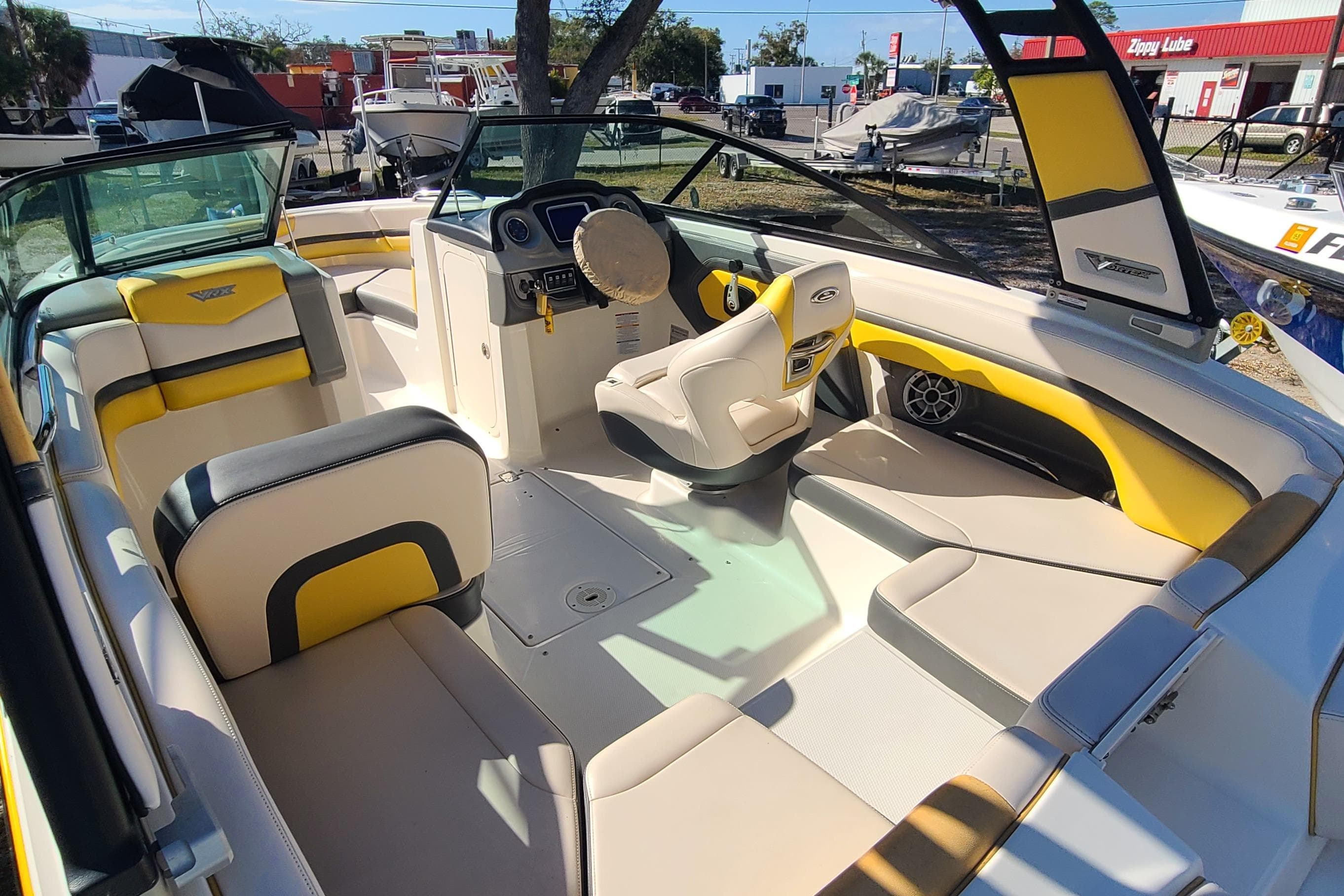 2017 Chaparral Vortex 203 VRX boat interior with yellow and white seating.