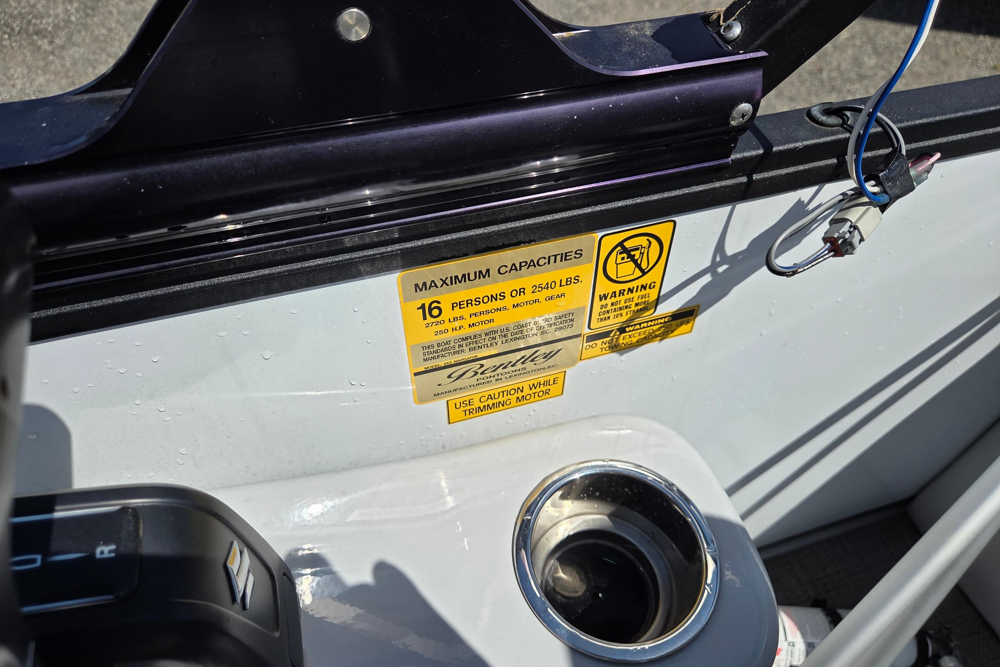 2022 Bentley Pontoons 240 Navigator capacity label, showing 16-person limit and safety warnings.
