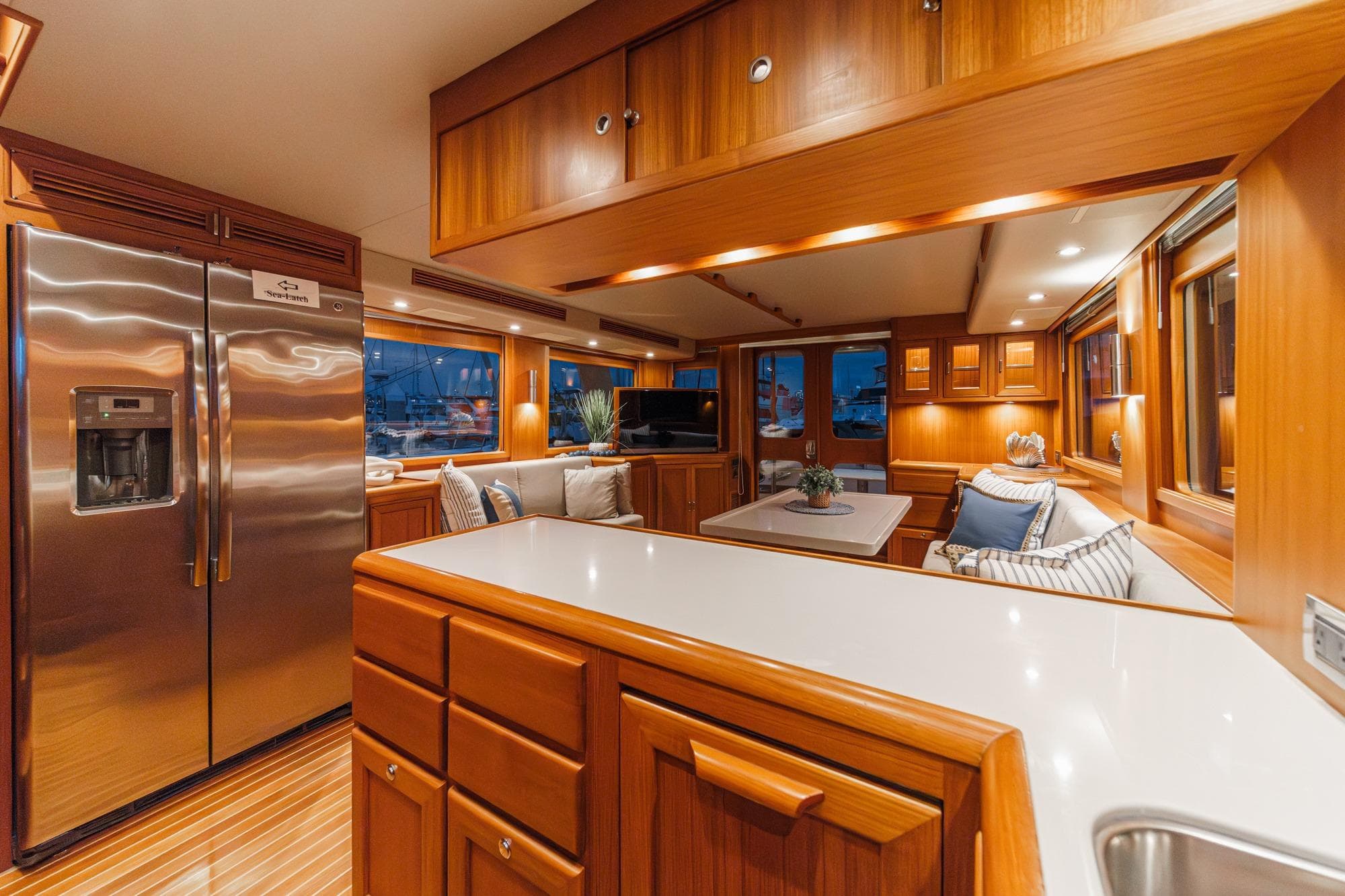 Luxurious 2018 Fleming 58 Pilothouse yacht interior with elegant wood finishes and modern amenities.