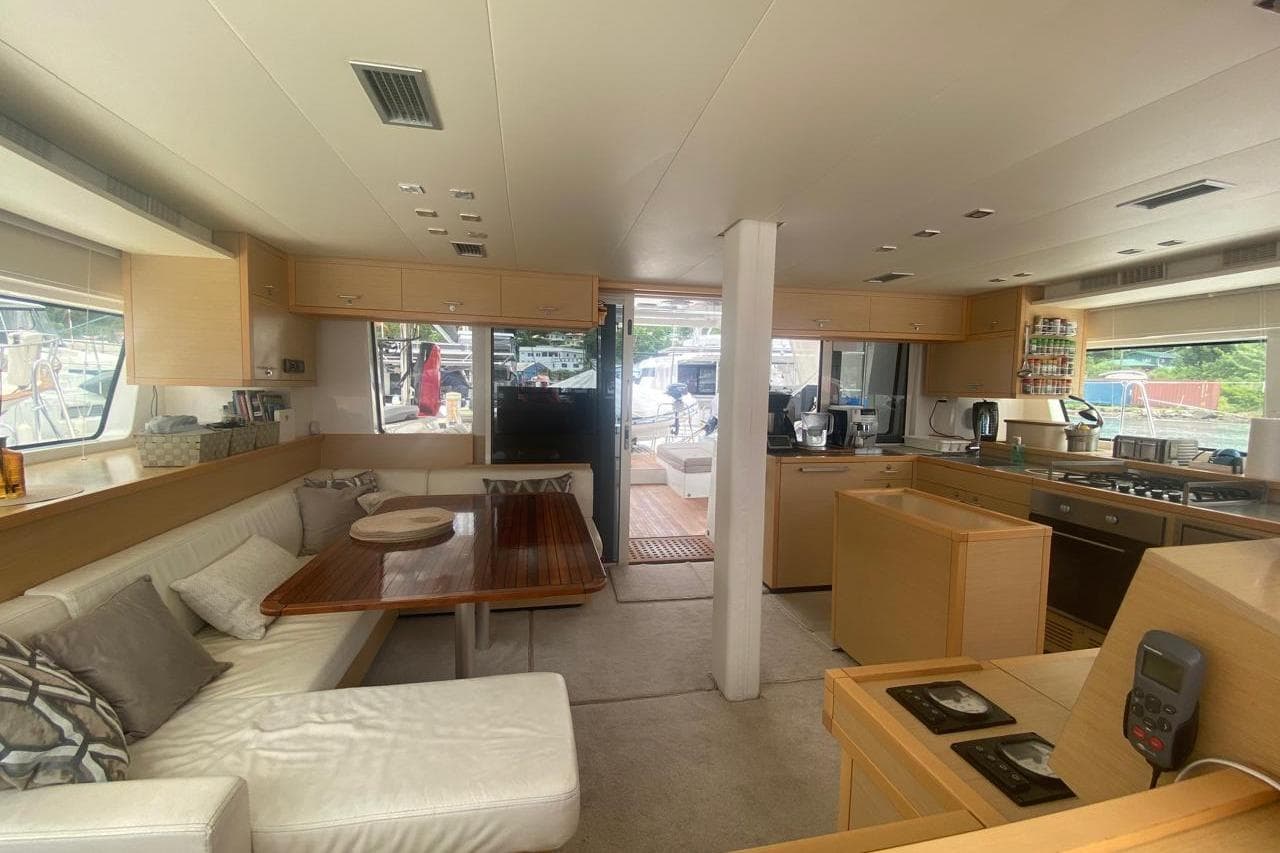 Interior of 2014 Lagoon 52 F yacht, featuring modern kitchen and cozy seating area.