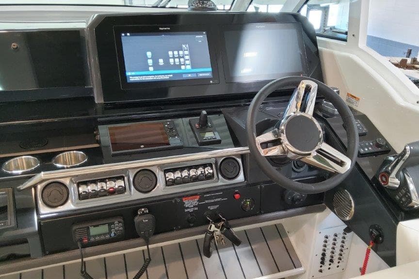2022 Formula 380 Super Sport Crossover OB dashboard with modern controls and steering wheel.