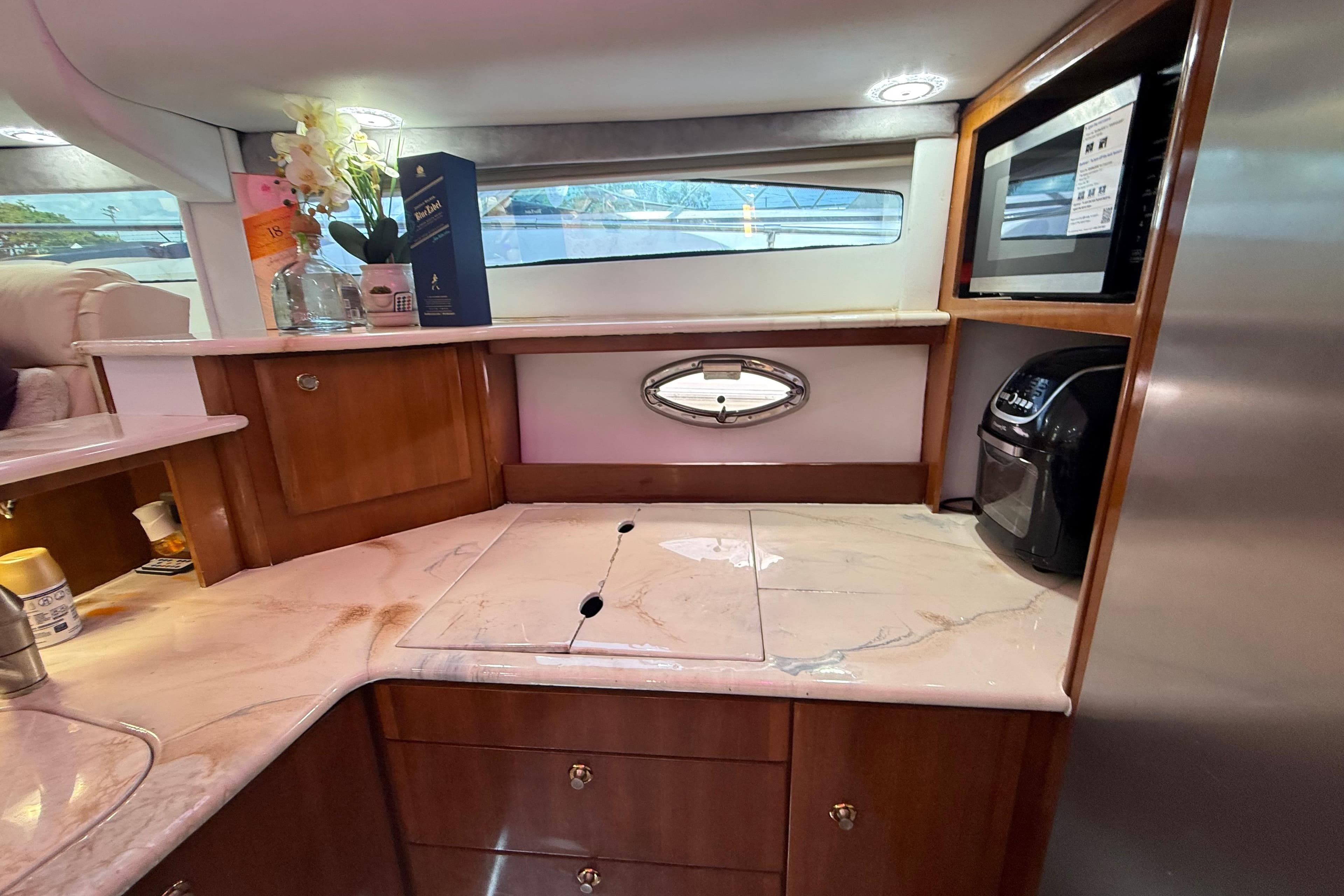 Luxurious 2007 Meridian 459 Motoryacht interior with elegant kitchen and modern appliances.