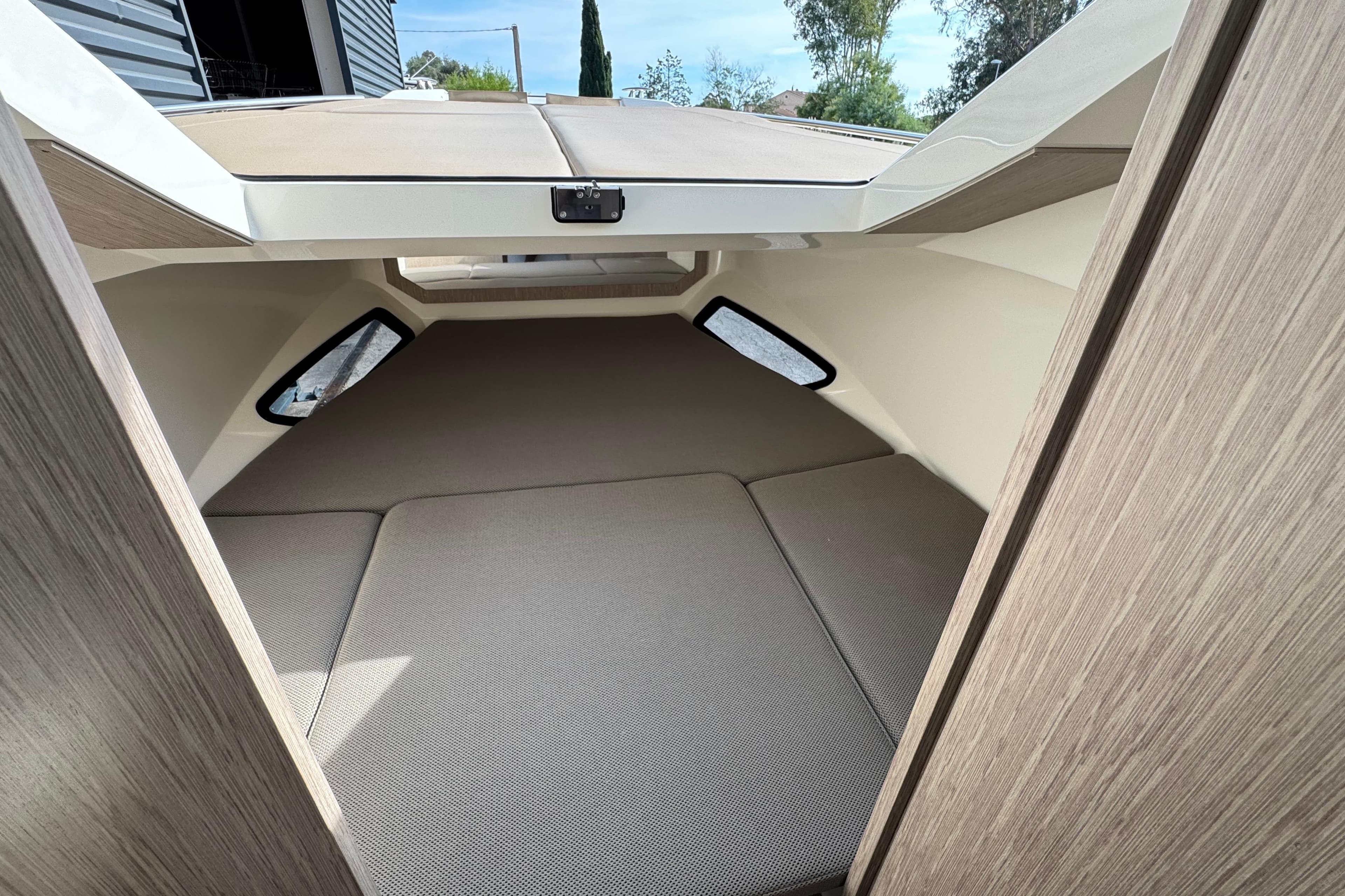 2025 Nuova Jolly Prince 30 Sport Cabin interior with cozy sleeping area.