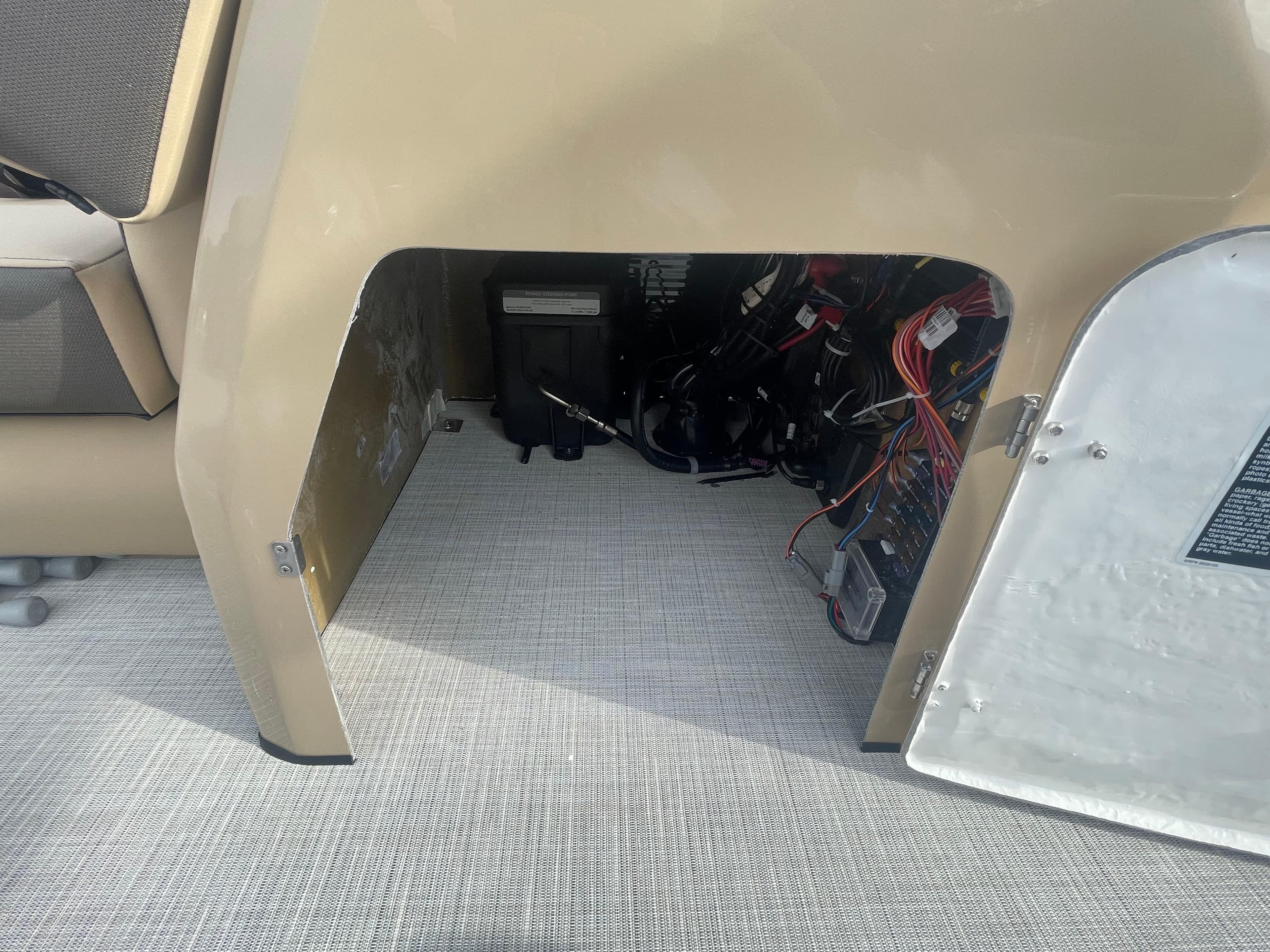 2023 Harris Sunliner 250 interior wiring compartment with open access panel.