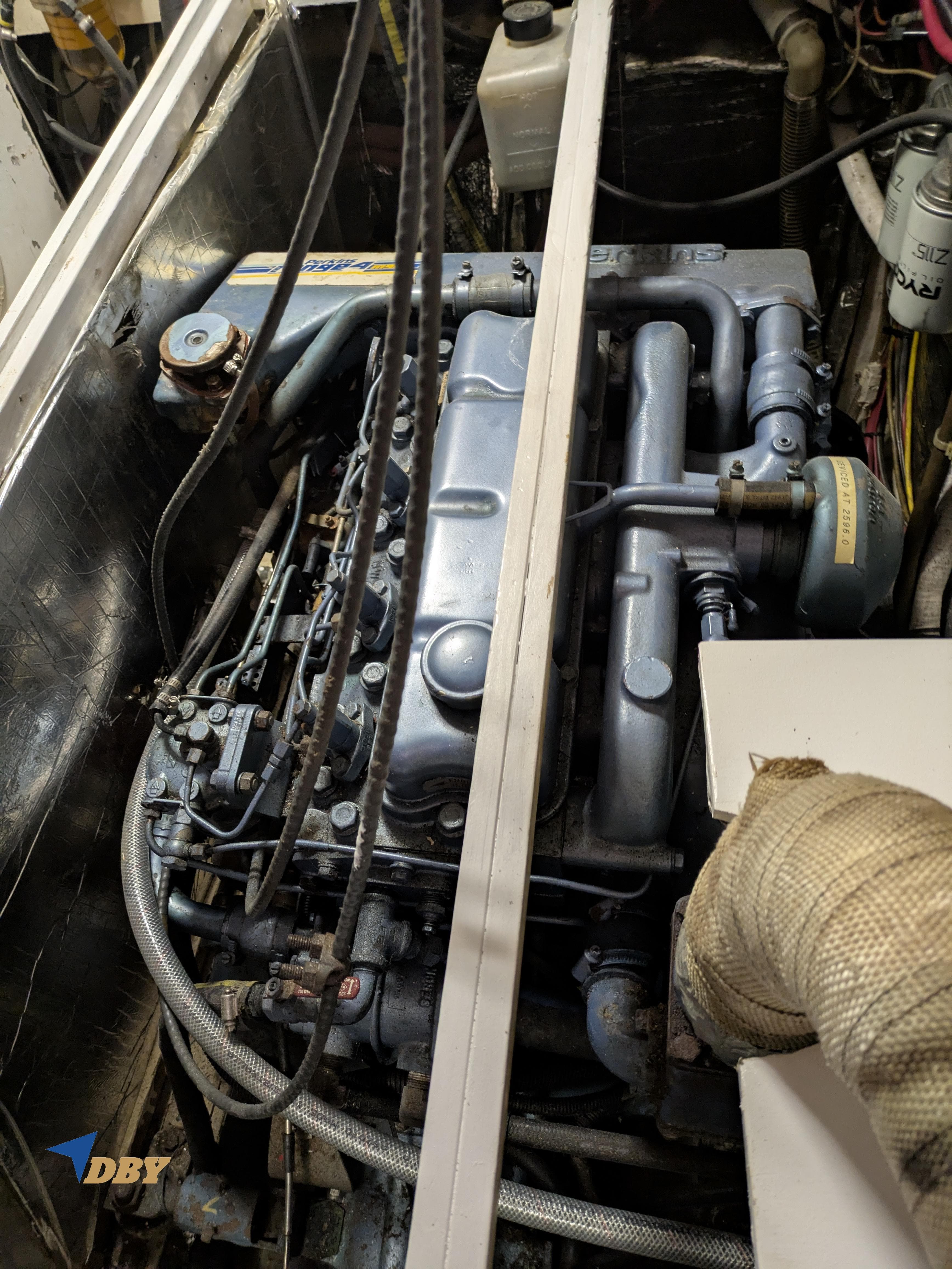 Engine compartment of a 1979 Spencer Yachts 53 (extended 55) model, showcasing mechanical components.