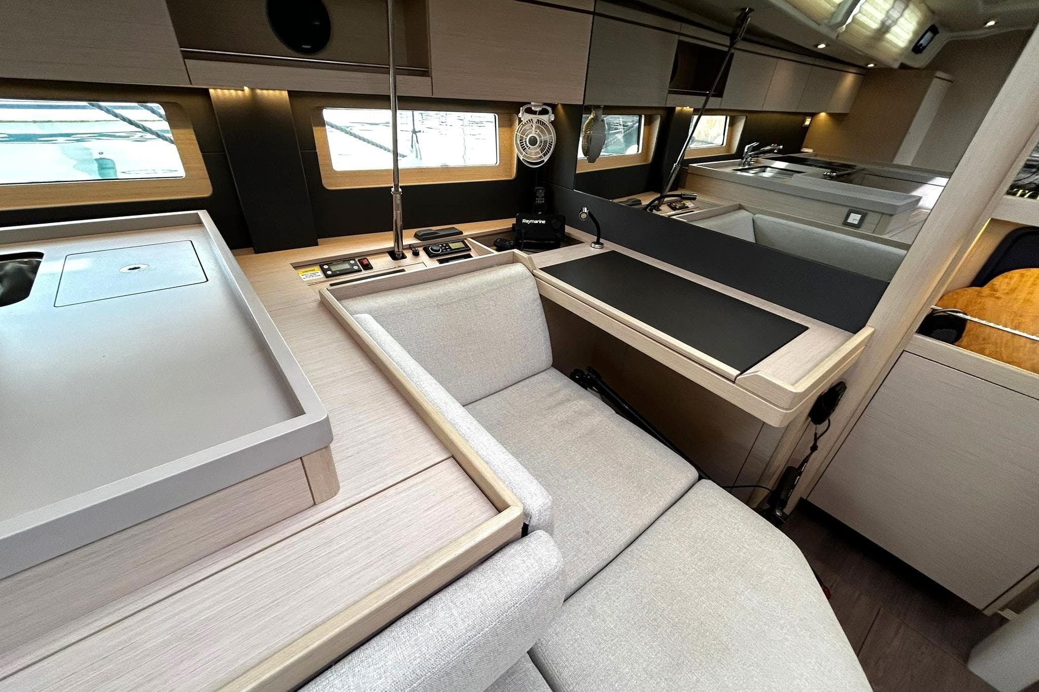 Modern interior of 2021 Beneteau Oceanis 51.1 yacht with sleek design and comfortable seating.