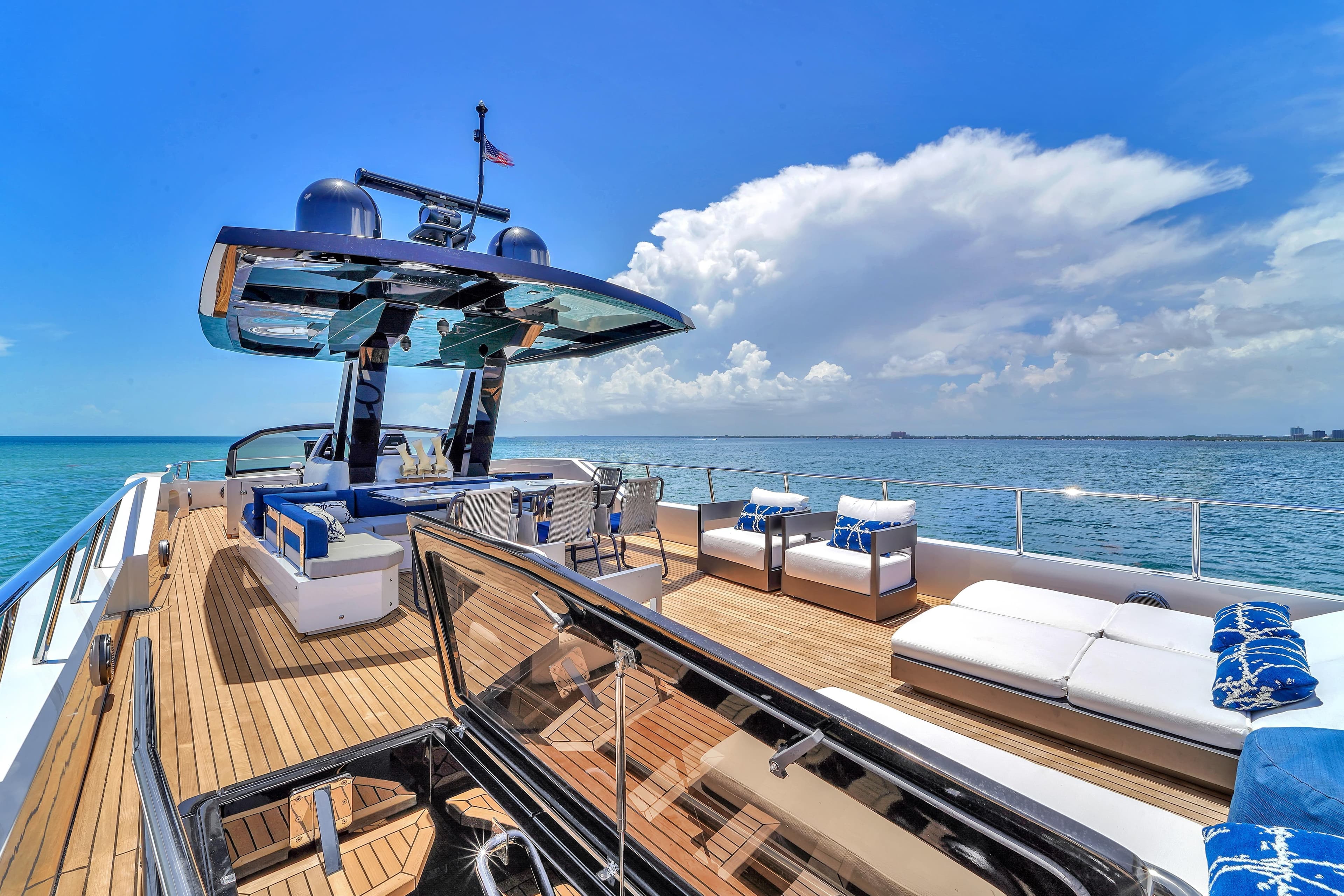 Luxurious 2021 OKEAN 80 yacht deck with modern seating and ocean view.