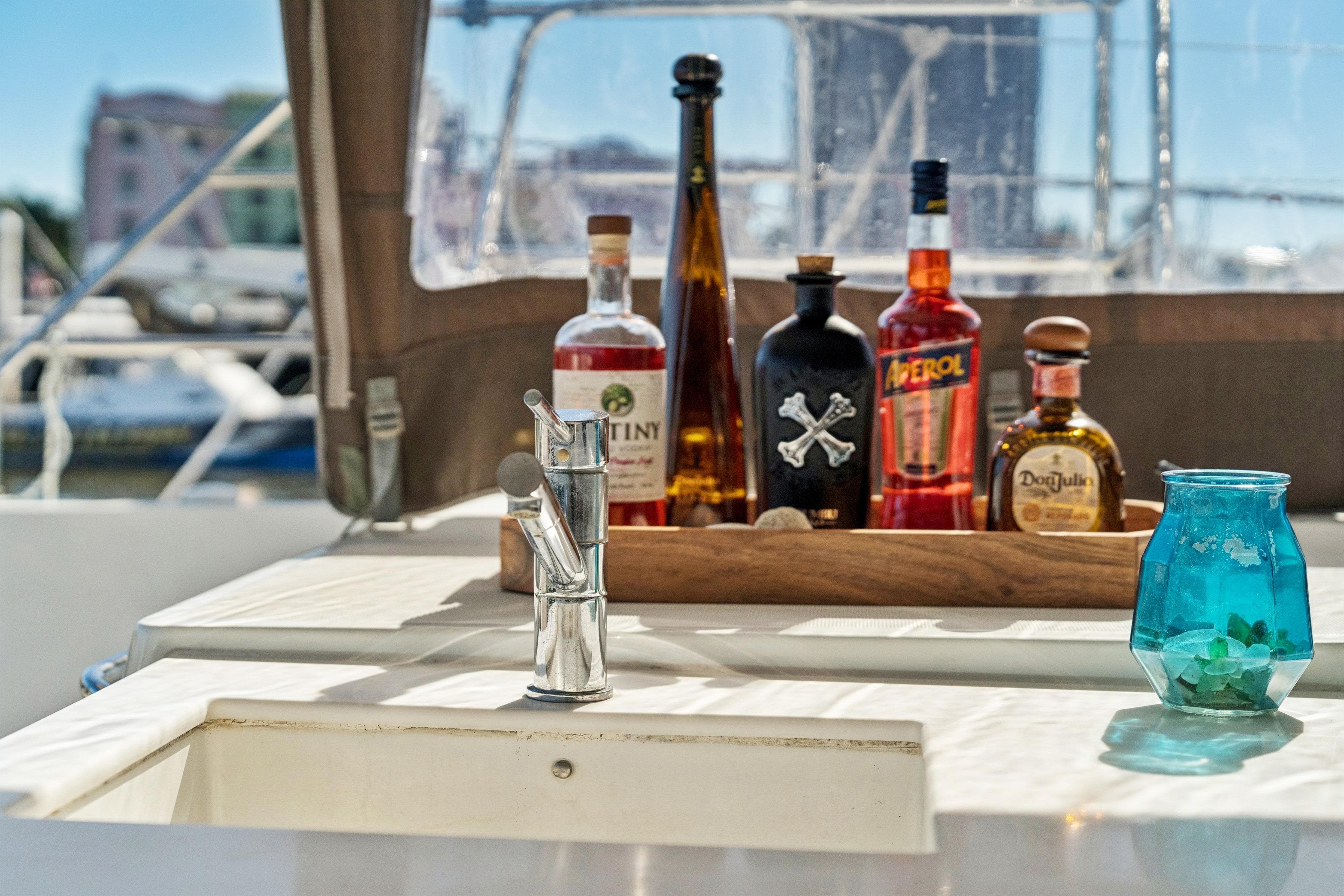 Luxury yacht Lagoon 560 (2012) with bar setup and sink on deck.