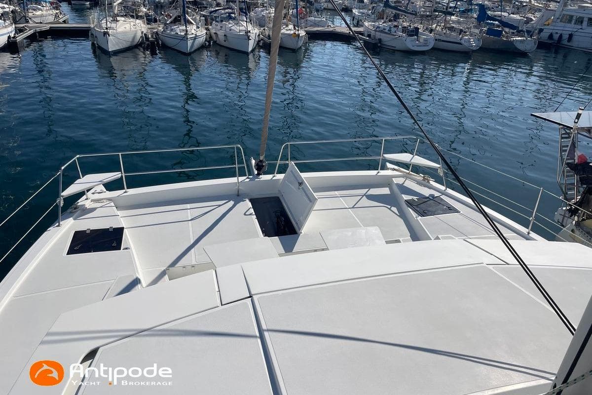 2018 Bali 4.3 catamaran docked in marina, showcasing spacious deck and sleek design.
