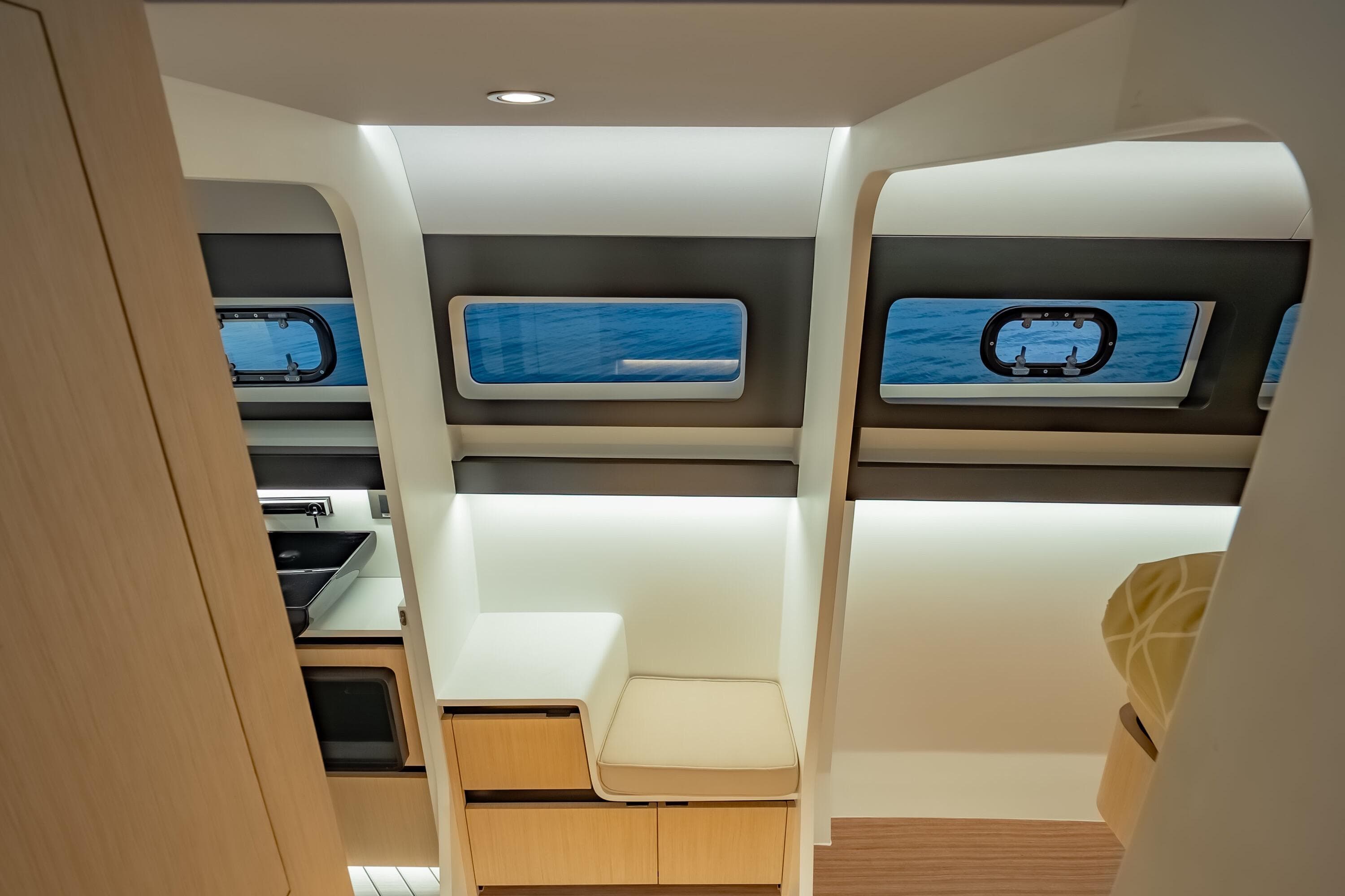 Interior of 2025 Adventure Yachts AY60 Sport, featuring modern design and ocean view windows.