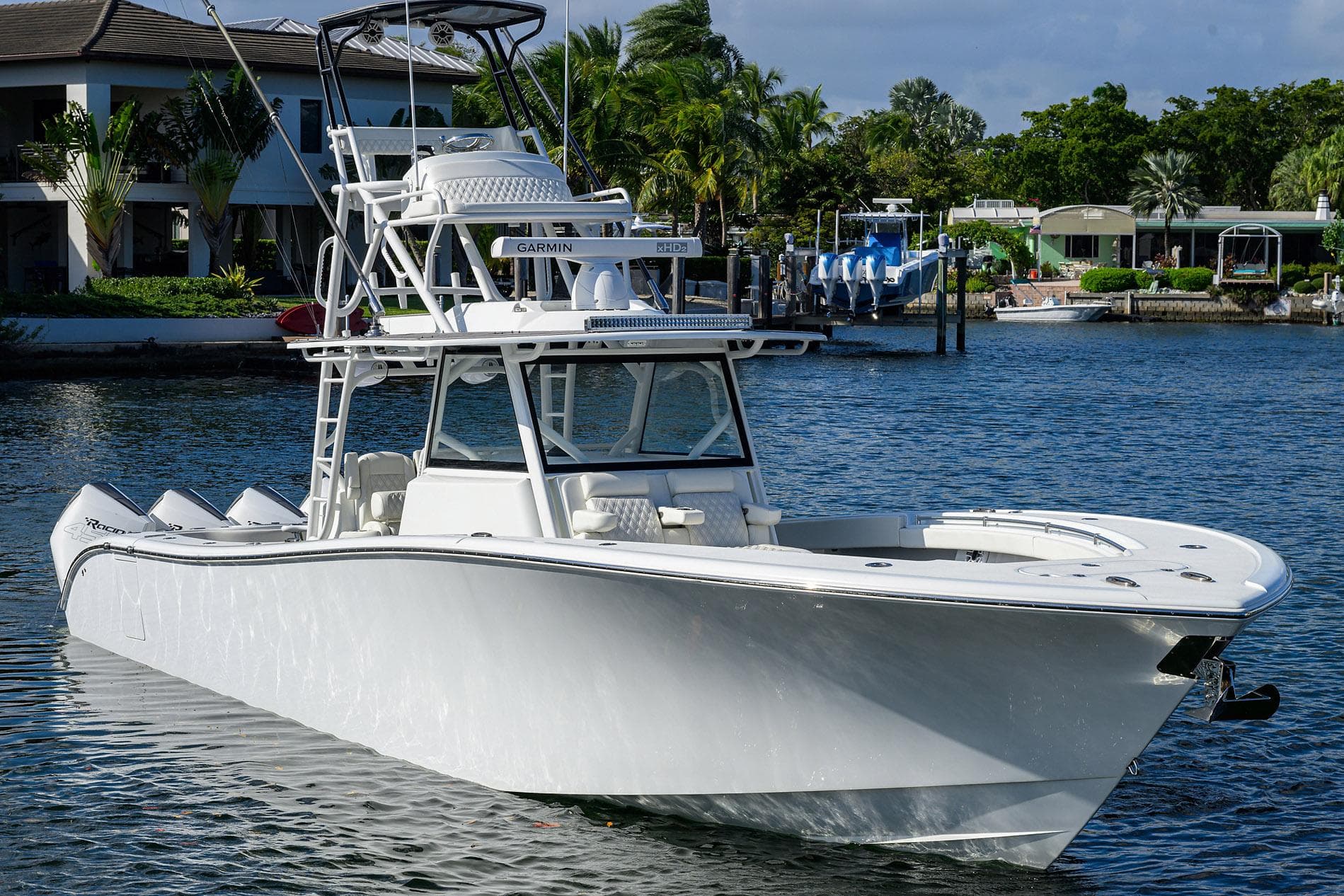 2021 Yellowfin 42 boat on calm water near waterfront homes.