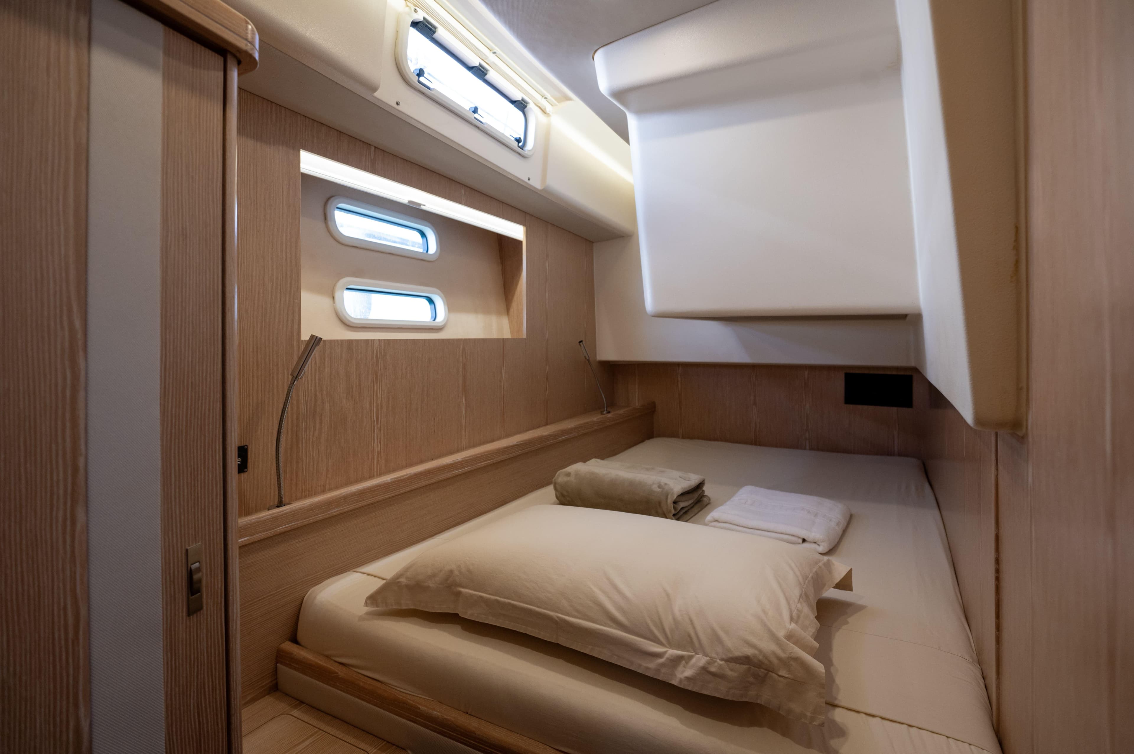 Luxurious cabin interior of 2016 Moody Decksaloon 54 yacht with modern design.