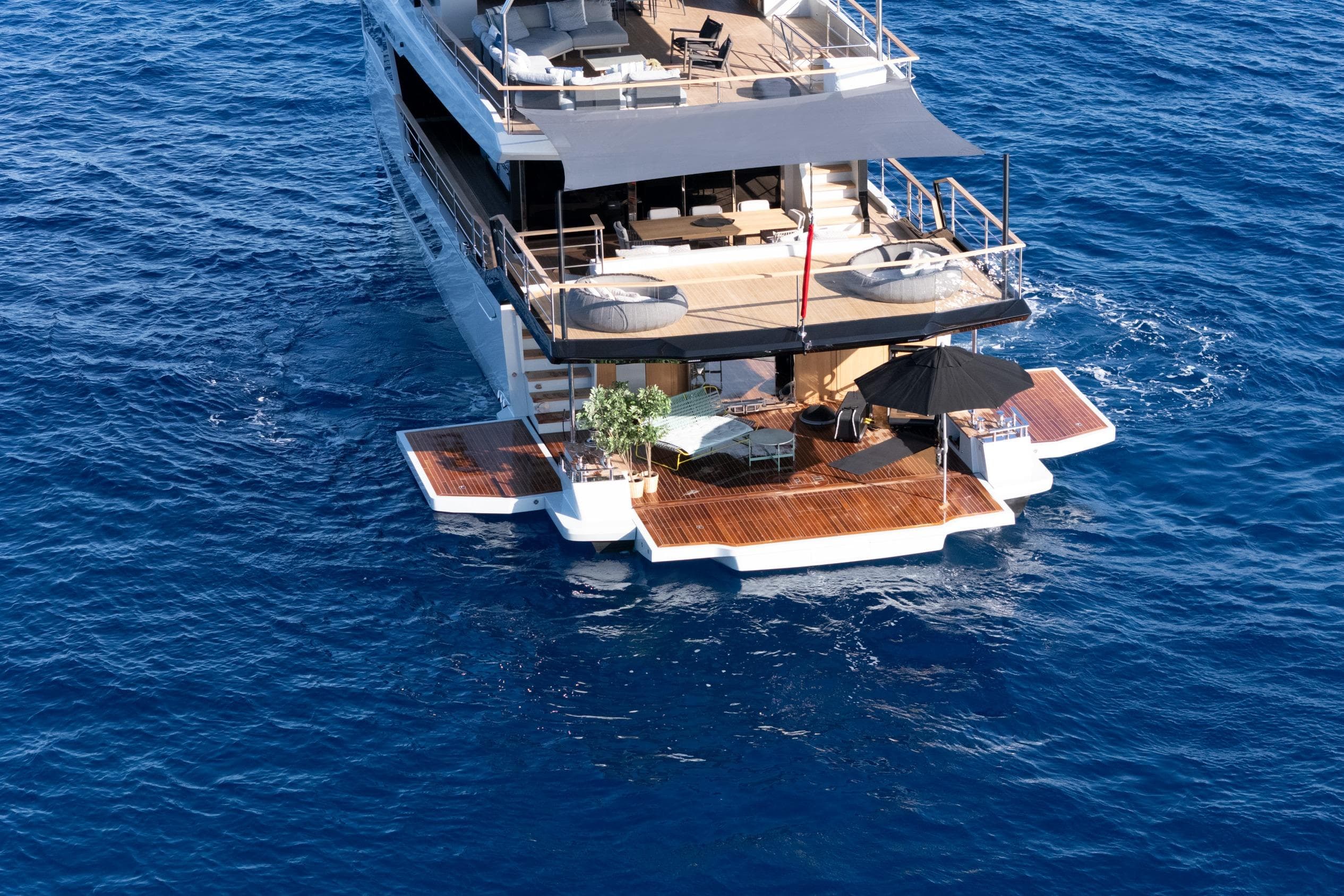 Luxury Numarine 30XP yacht, 2025 model, cruising on open blue sea.