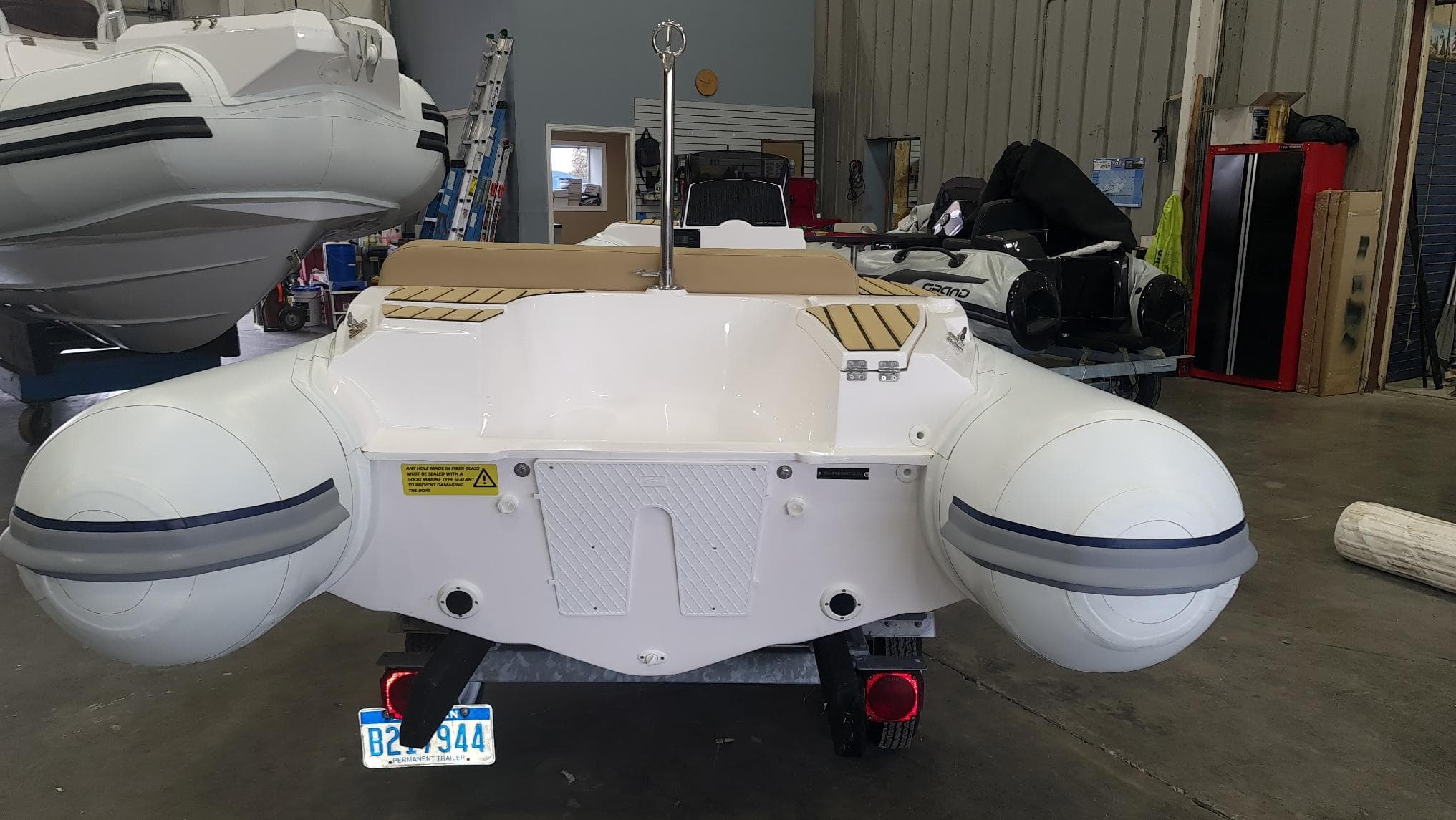 2023 Tiger Marine 370 PROTENDER inflatable boat in a workshop.