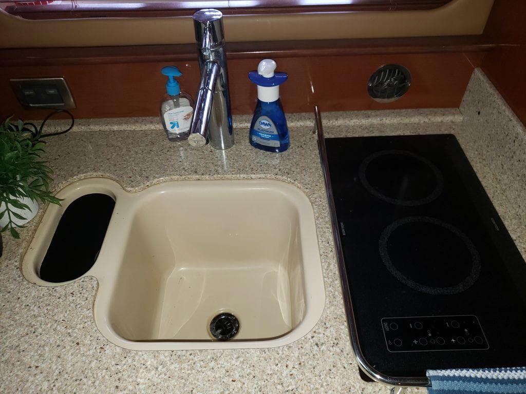 Galley sink and stove in 2008 Sea Ray 38 Sundancer yacht.