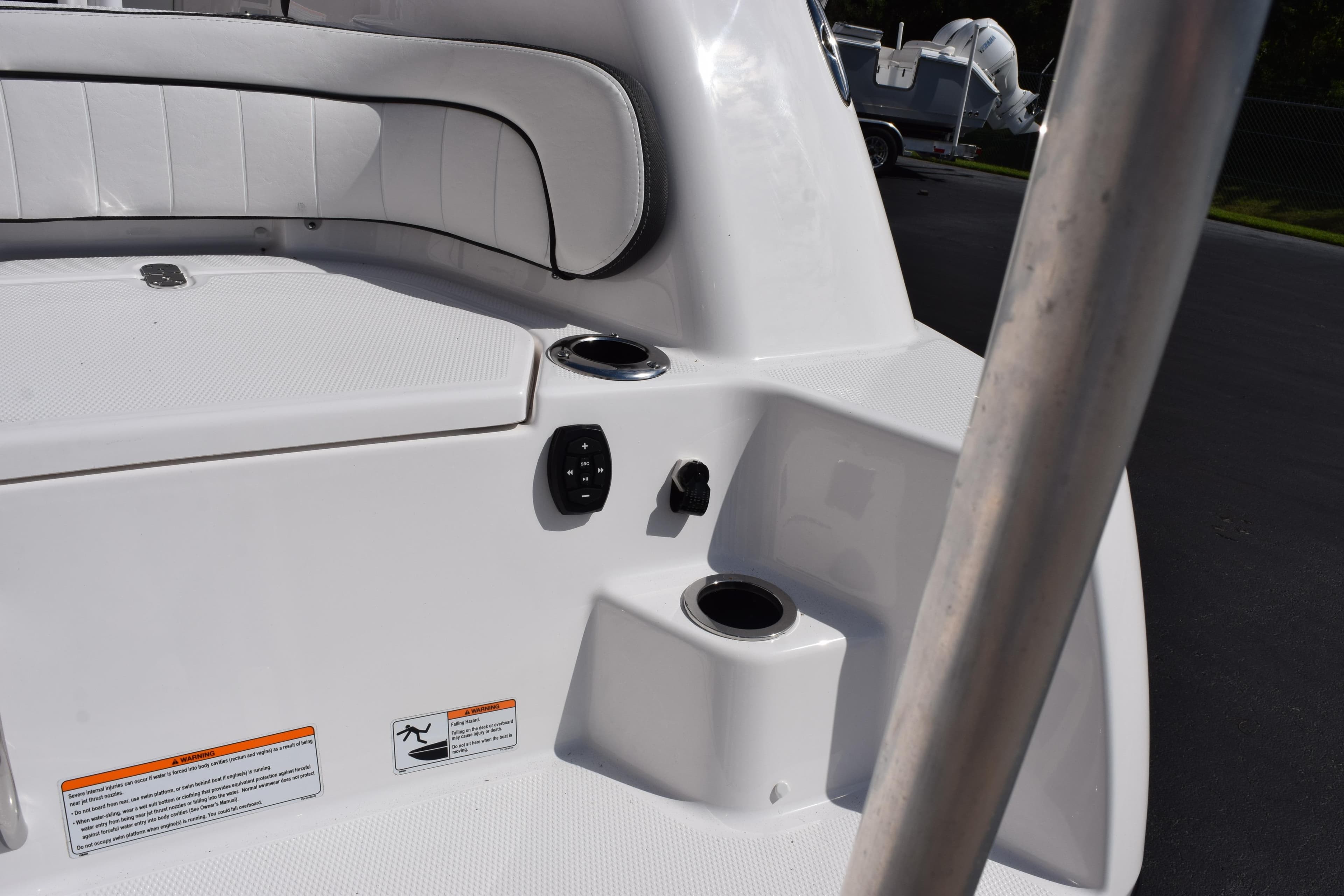 2026 Yamaha Boats 255 FSH Sport H interior with seating and cup holders.