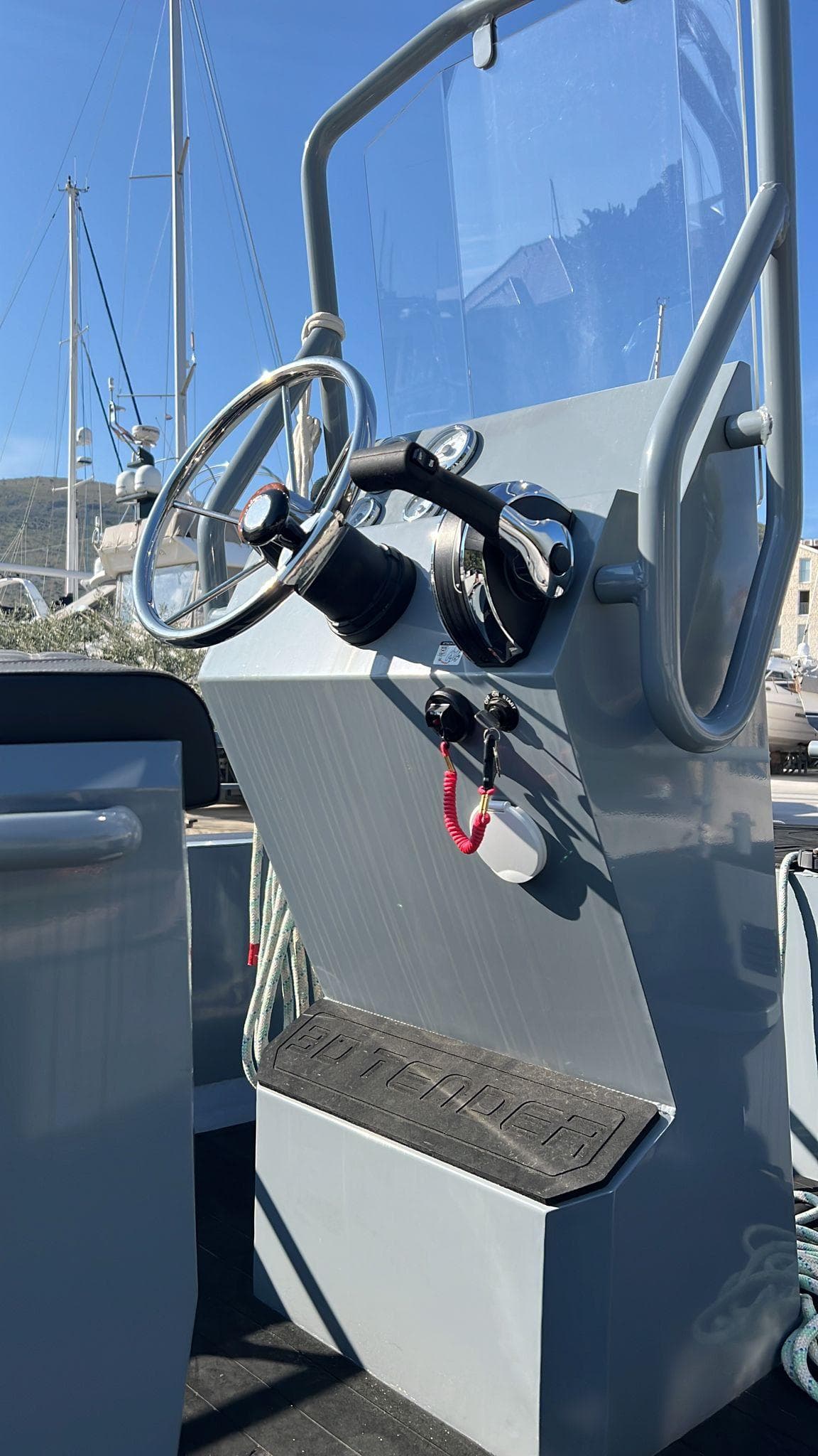 2023 3D Tender Pilot 420 boat console with steering wheel and controls.