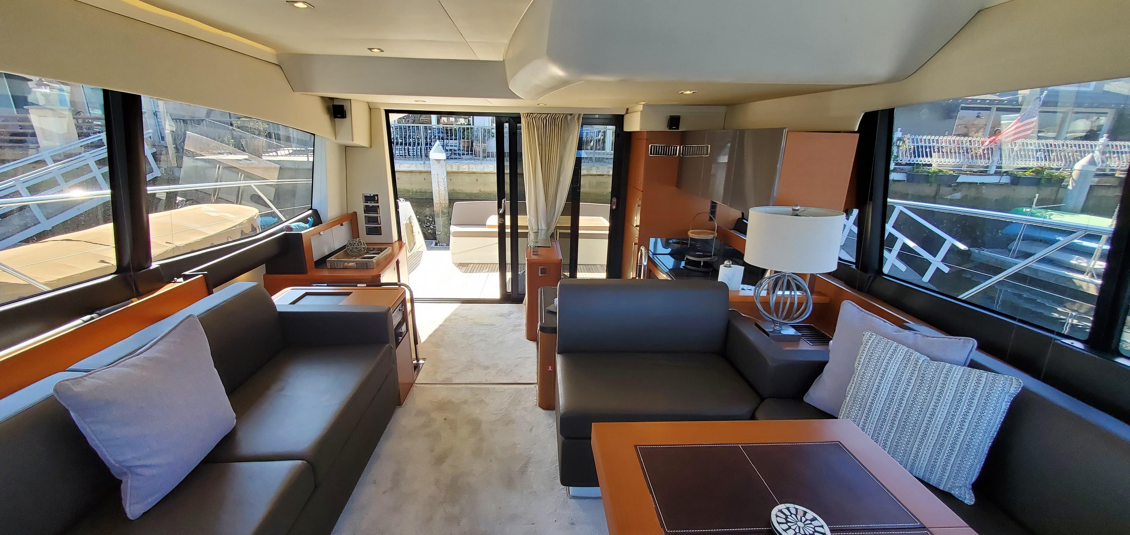 Luxurious interior of a 2017 Prestige 560 Flybridge yacht with elegant seating and decor.