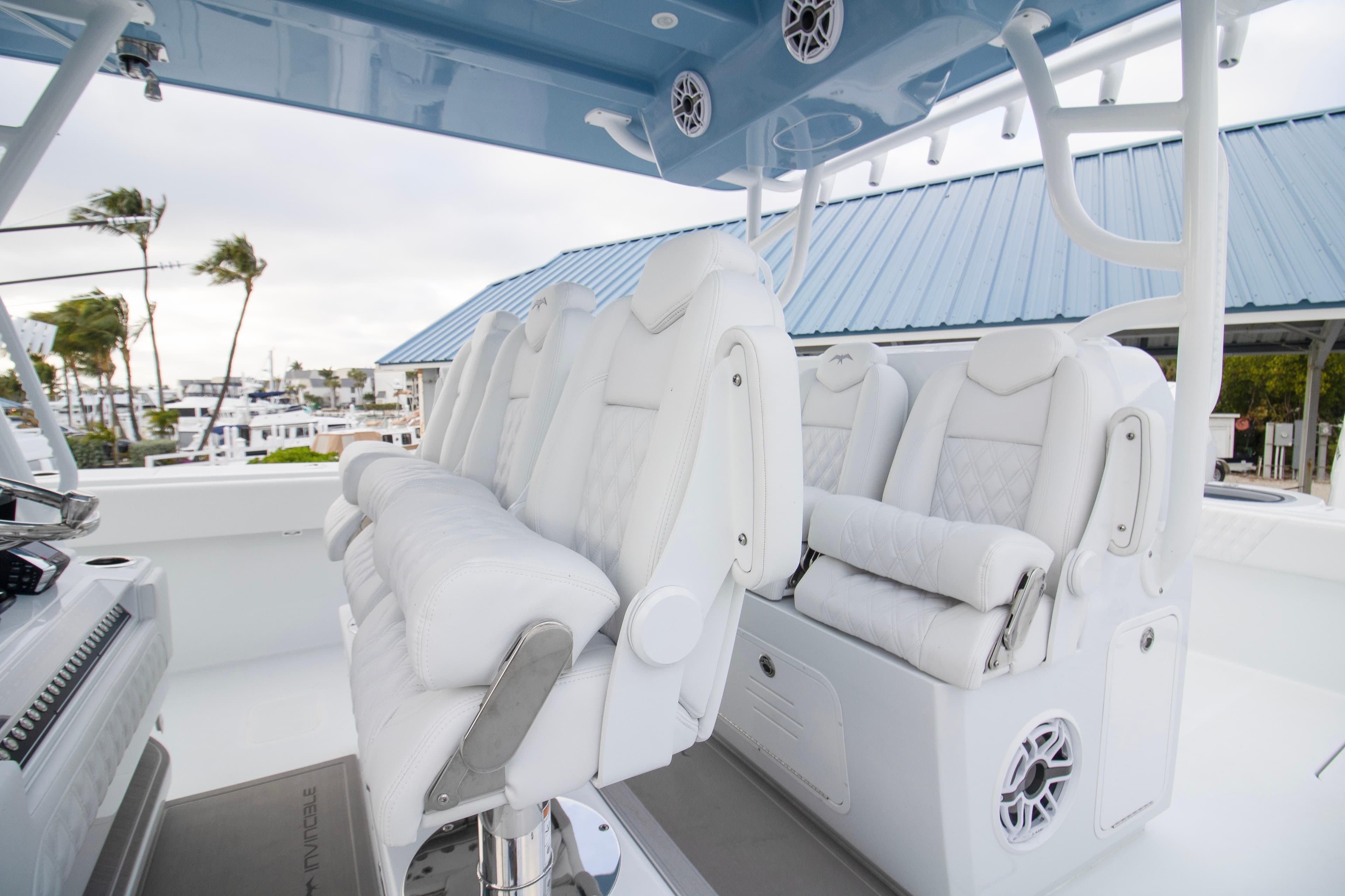 2026 Invincible 38 Catamaran interior with luxurious white seating and modern design.