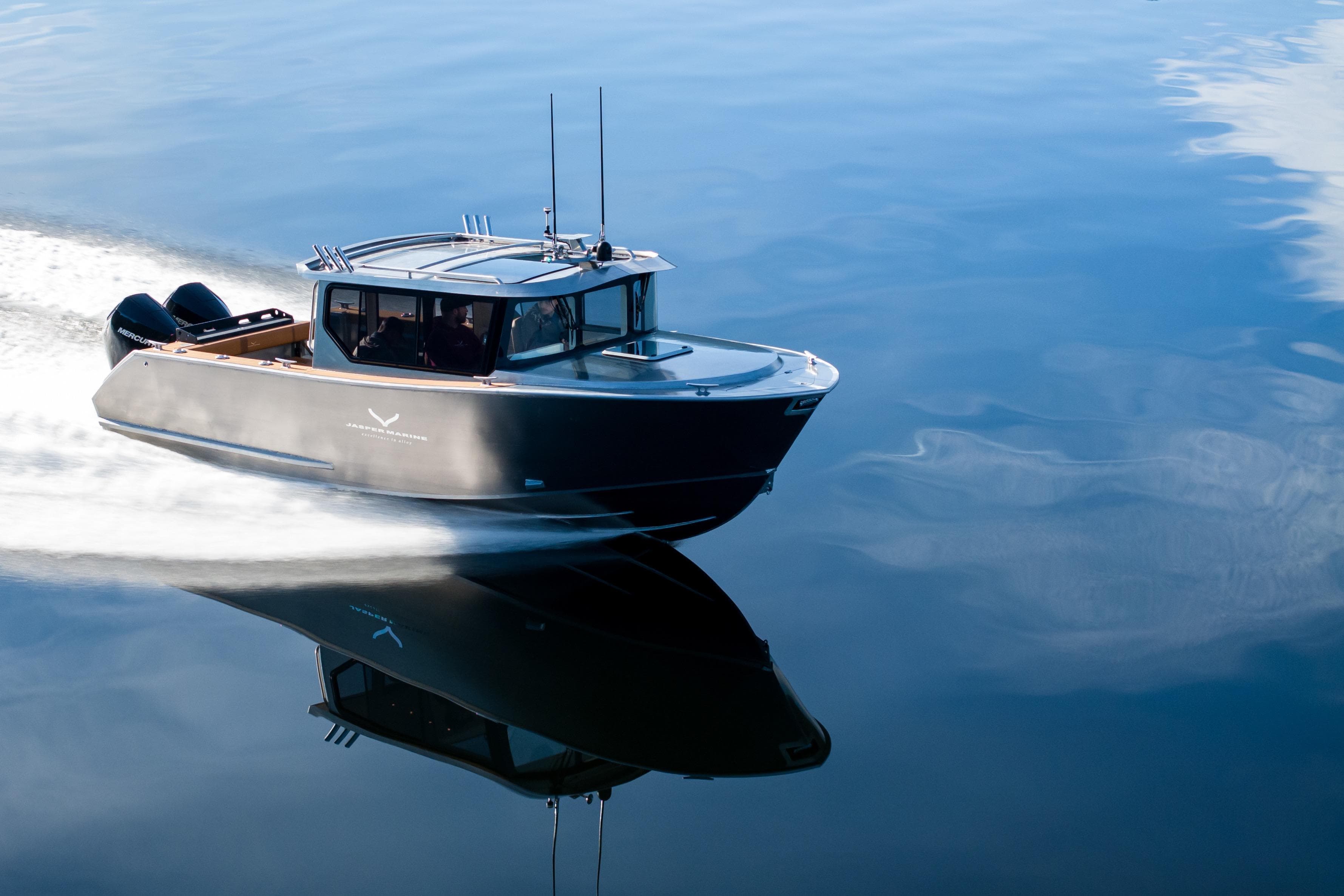 2026 Jasper Marine Defender 22 boat cruising on calm water.