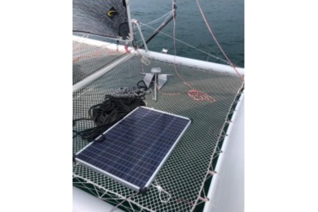 Solar panel on Prescott Firefly 850 catamaran netting, 2016 model, at sea.