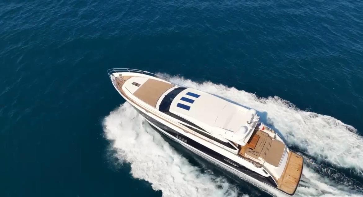 Aerial view of 2011 Princess V78 yacht cruising on open sea.