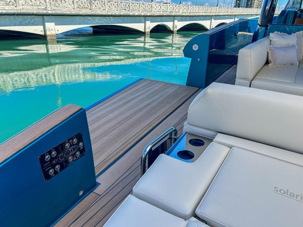 2024 Solaris Power 52 Open yacht with luxurious seating and scenic water view.