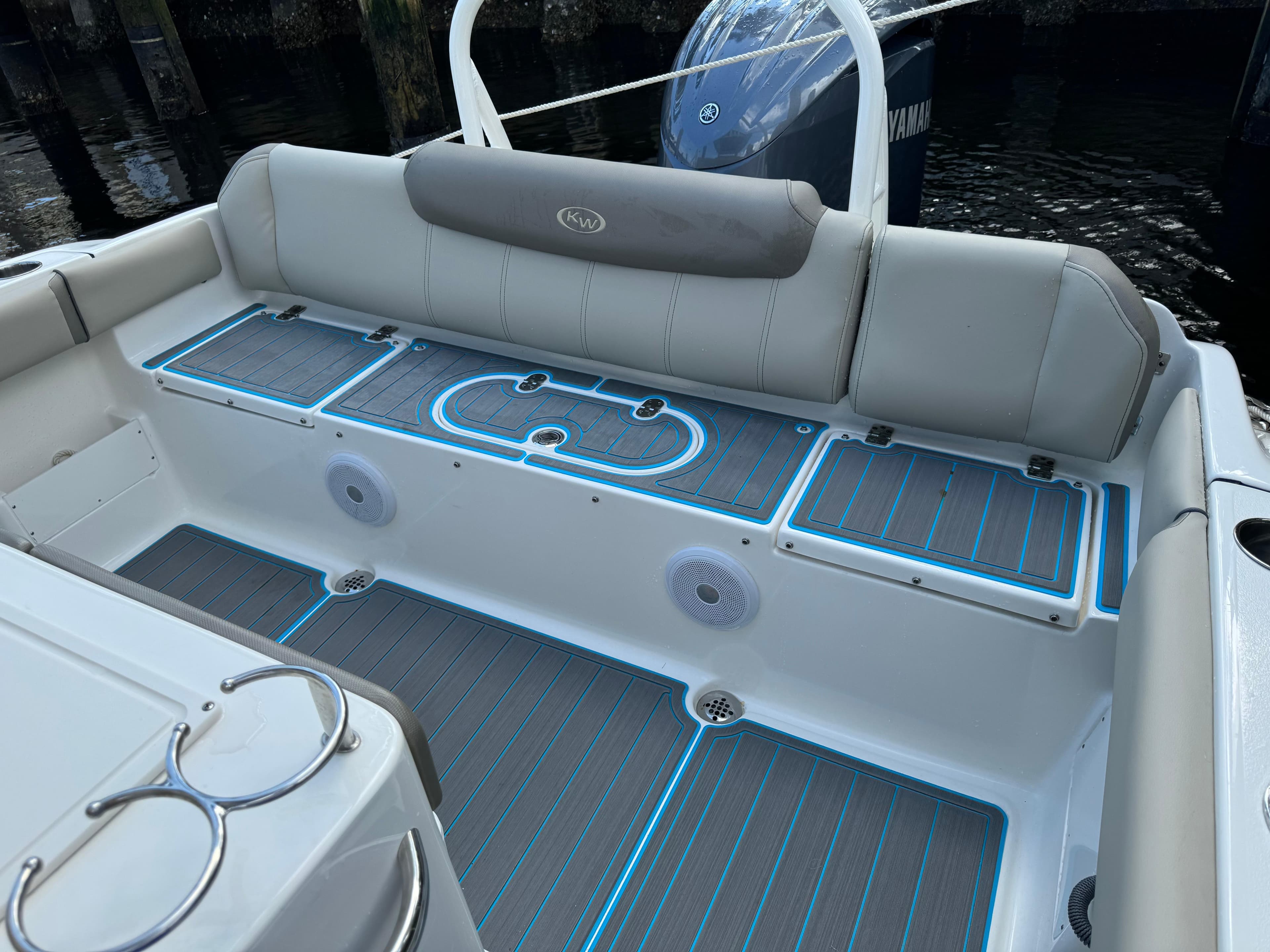 2024 Key West 239 FS boat interior with cushioned seating and LED floor lighting.
