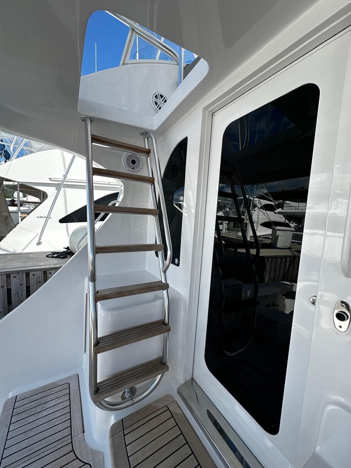 2011 Hatteras GT60 yacht with sleek ladder and modern design elements.