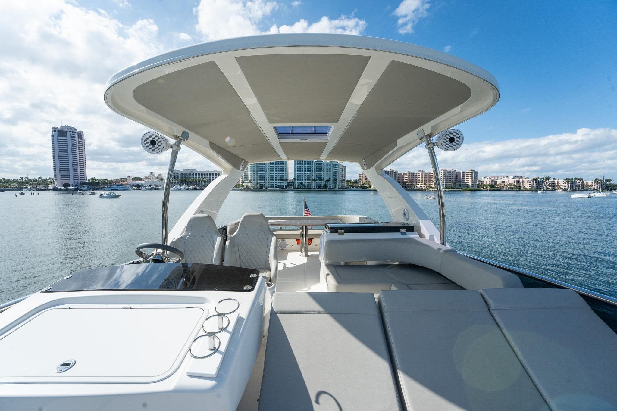 Luxurious 2020 Absolute 50 Fly yacht with spacious deck and scenic waterfront view.