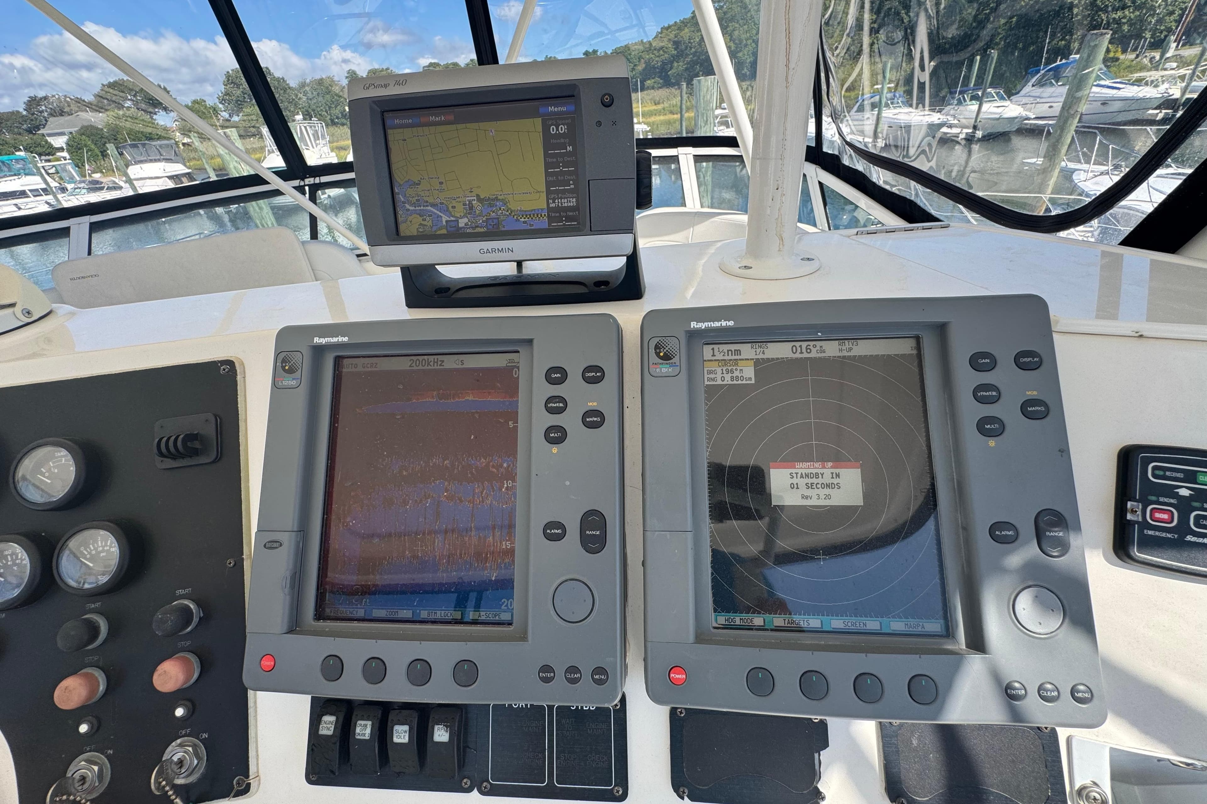 Control panel of a 2003 Silverton 42 Convertible yacht with navigation displays.