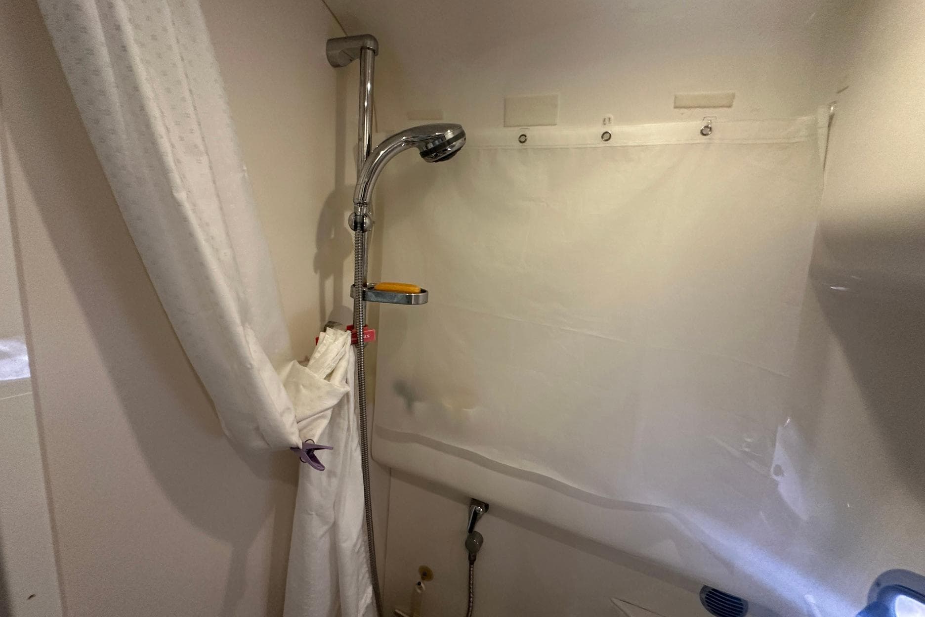 Shower area in 2005 Formula 37 PC boat with curtain and handheld showerhead.