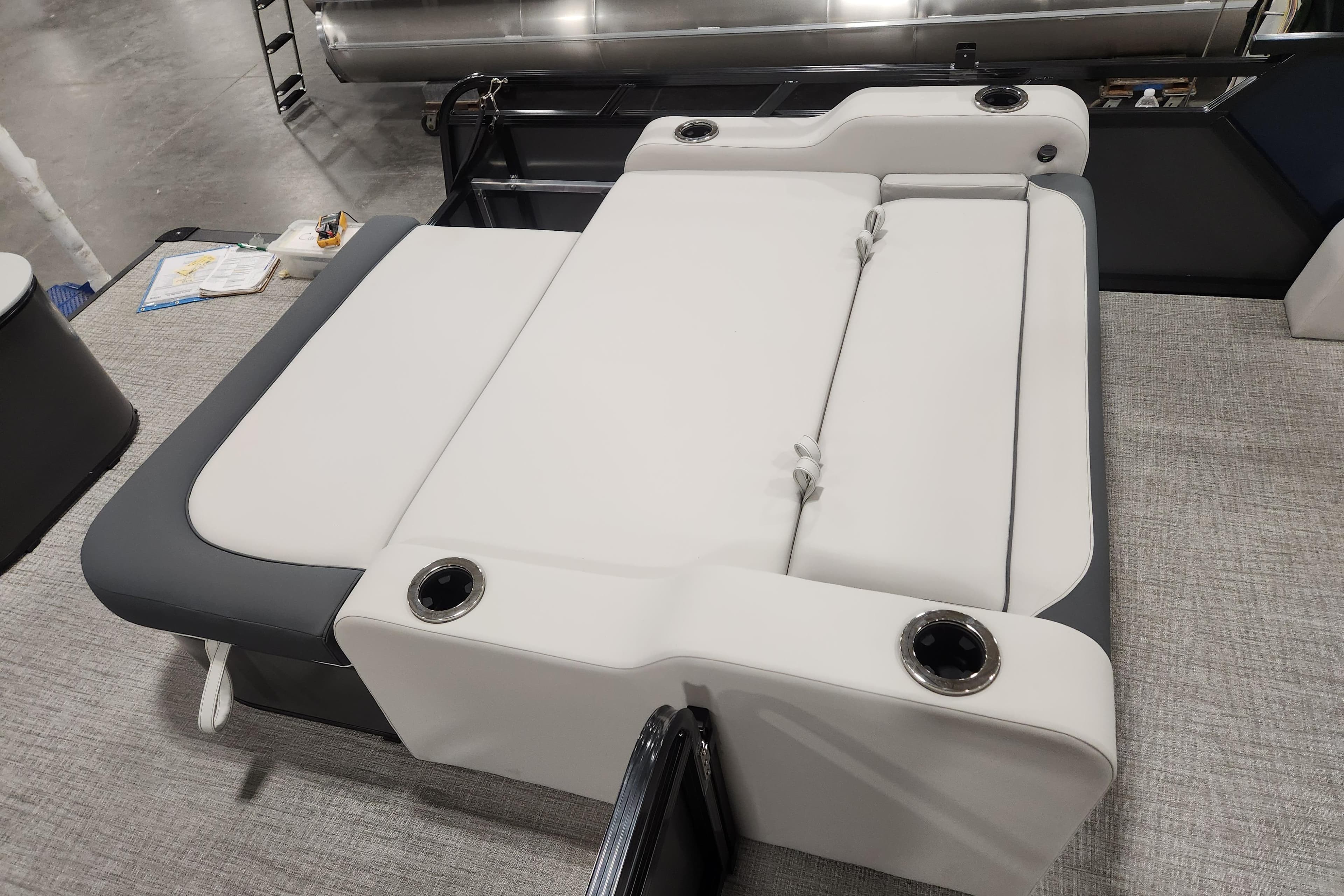 2026 Tahoe Pontoon 23 LTZ Rear Bench with sleek white and gray upholstery.
