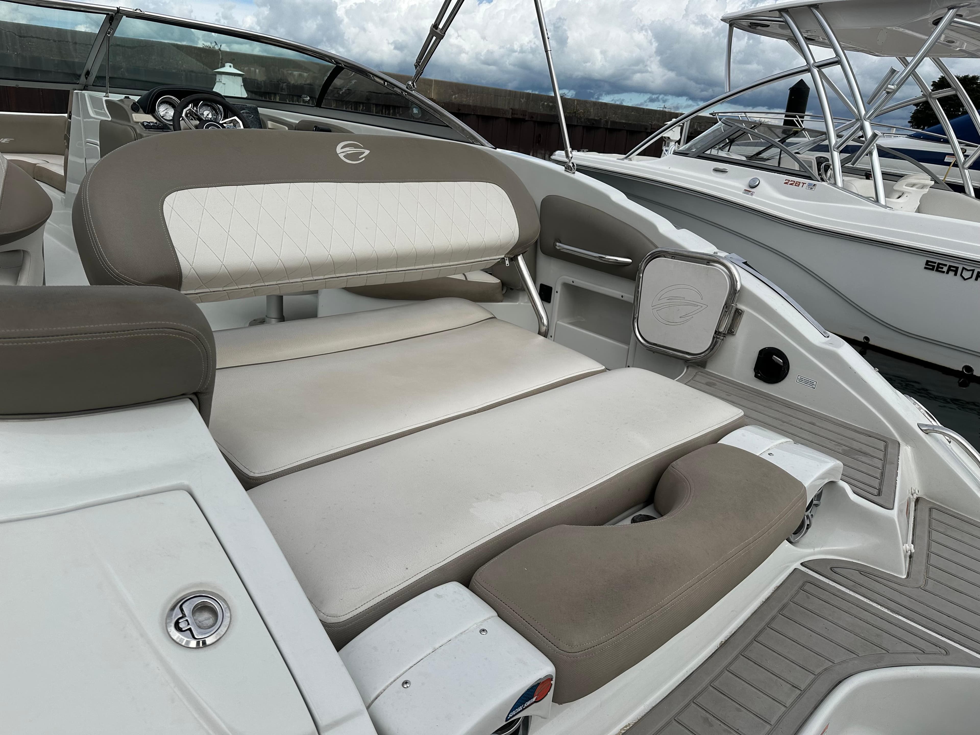 2020 Crownline E235XS boat interior with cushioned seating and modern design.