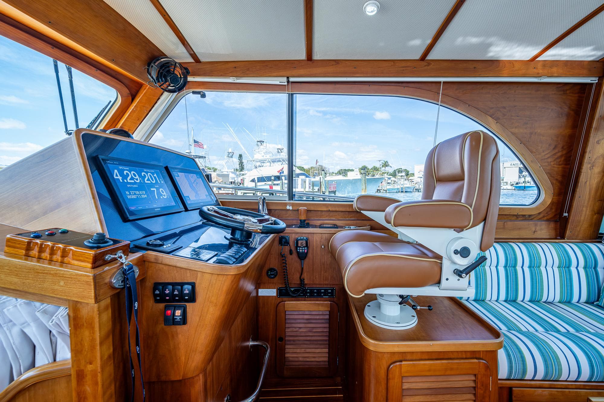 Interior of 2008 Hinckley Talaria 44 FB yacht with helm and seating area.