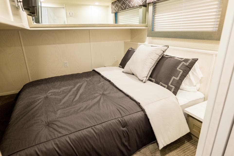 Luxurious bedroom interior in 2026 Sumerset Luxe III houseboat, featuring elegant bedding and modern design.