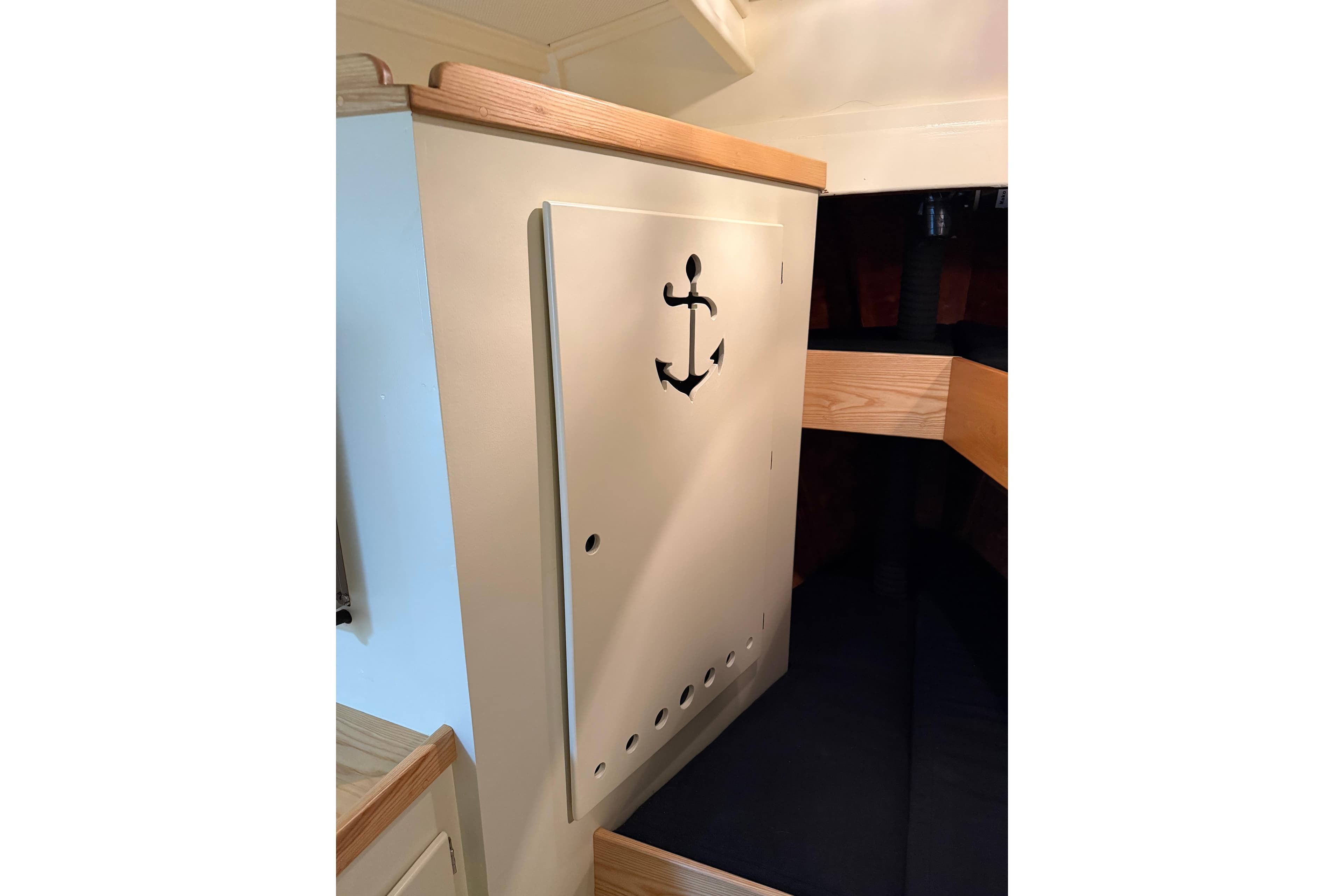 Interior of 2022 Covey Island 38 Lobster Yacht with anchor design on cabinet.