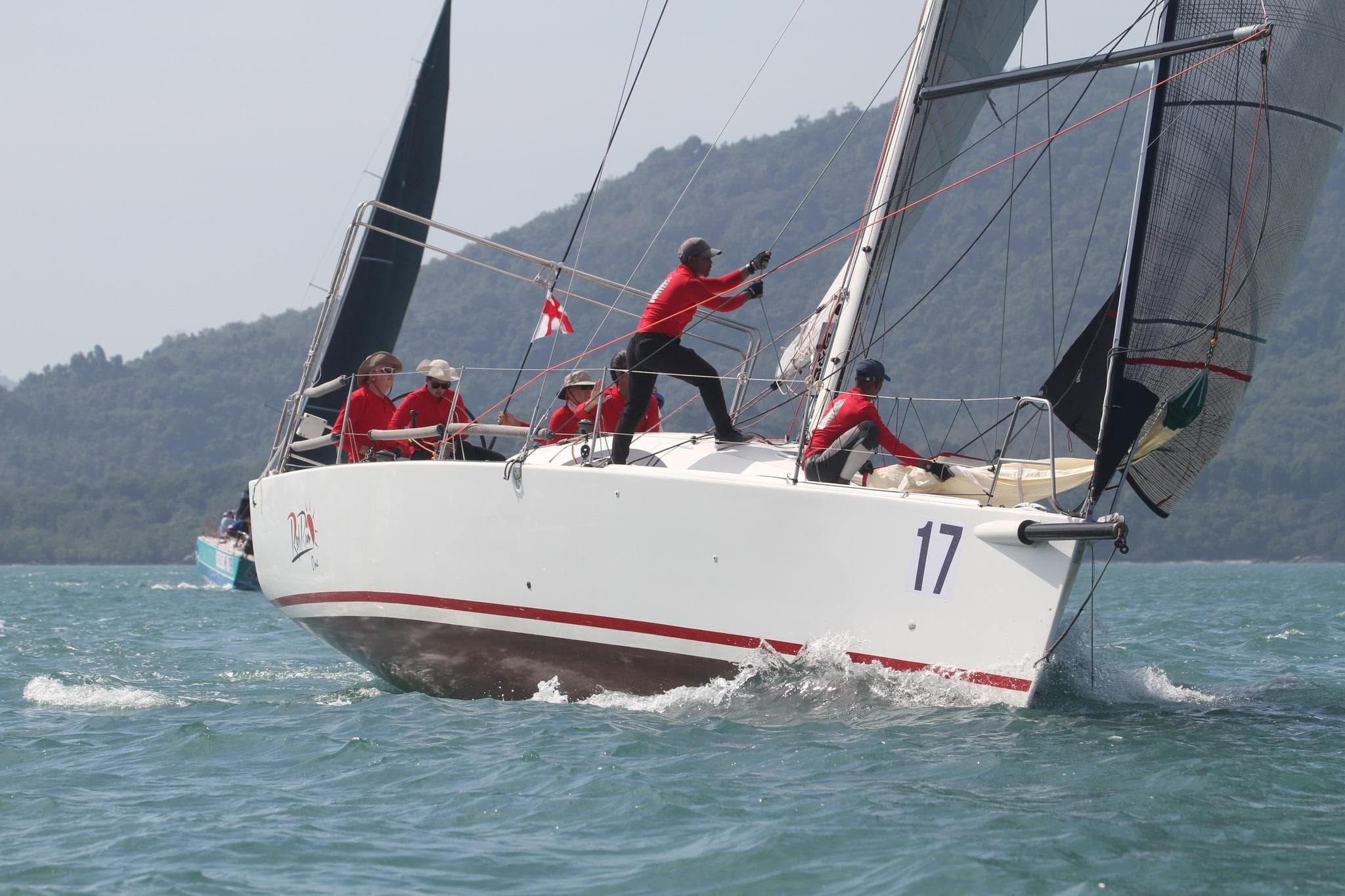 Sailing team on 2010 Archambault A40 RC yacht racing in open waters.