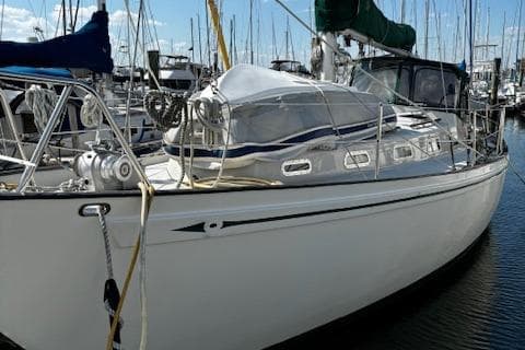 1978 Rival 41C sailboat docked in marina, featuring sleek design and classic lines.
