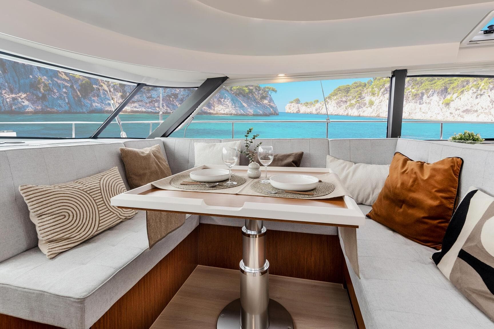 Luxurious interior of 2026 Moody 48 Deck Salon yacht with scenic ocean view.