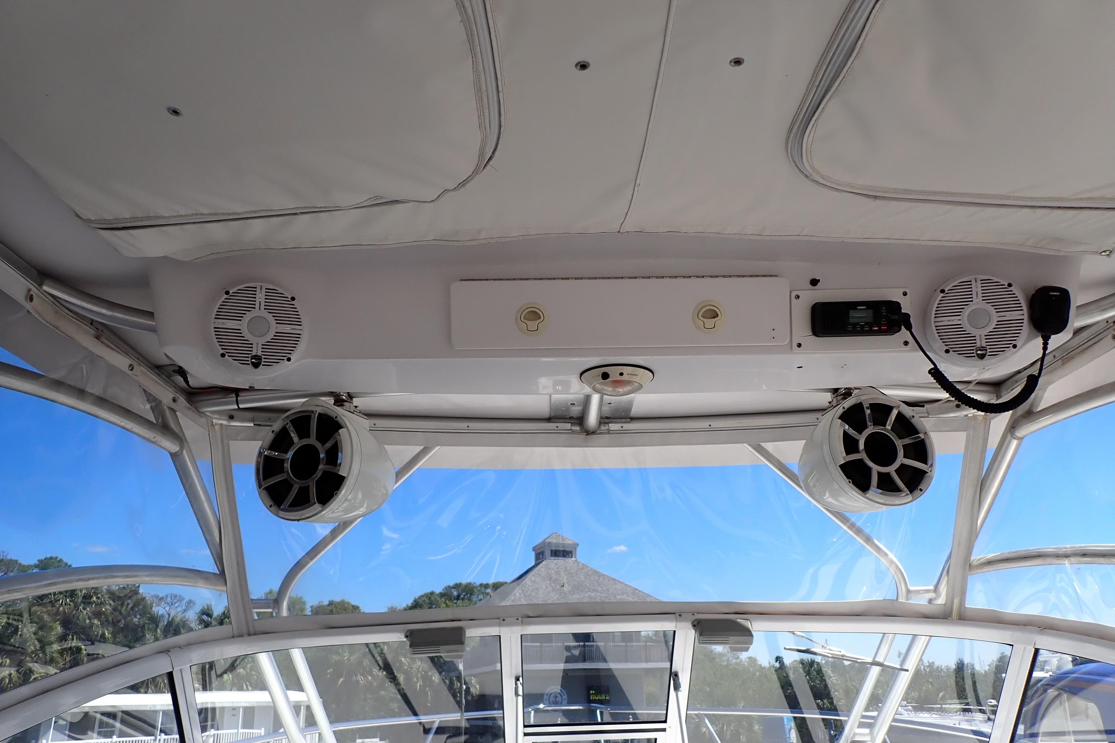 Interior view of a 2014 Pro-Line 32 Express boat with speakers and radio system.