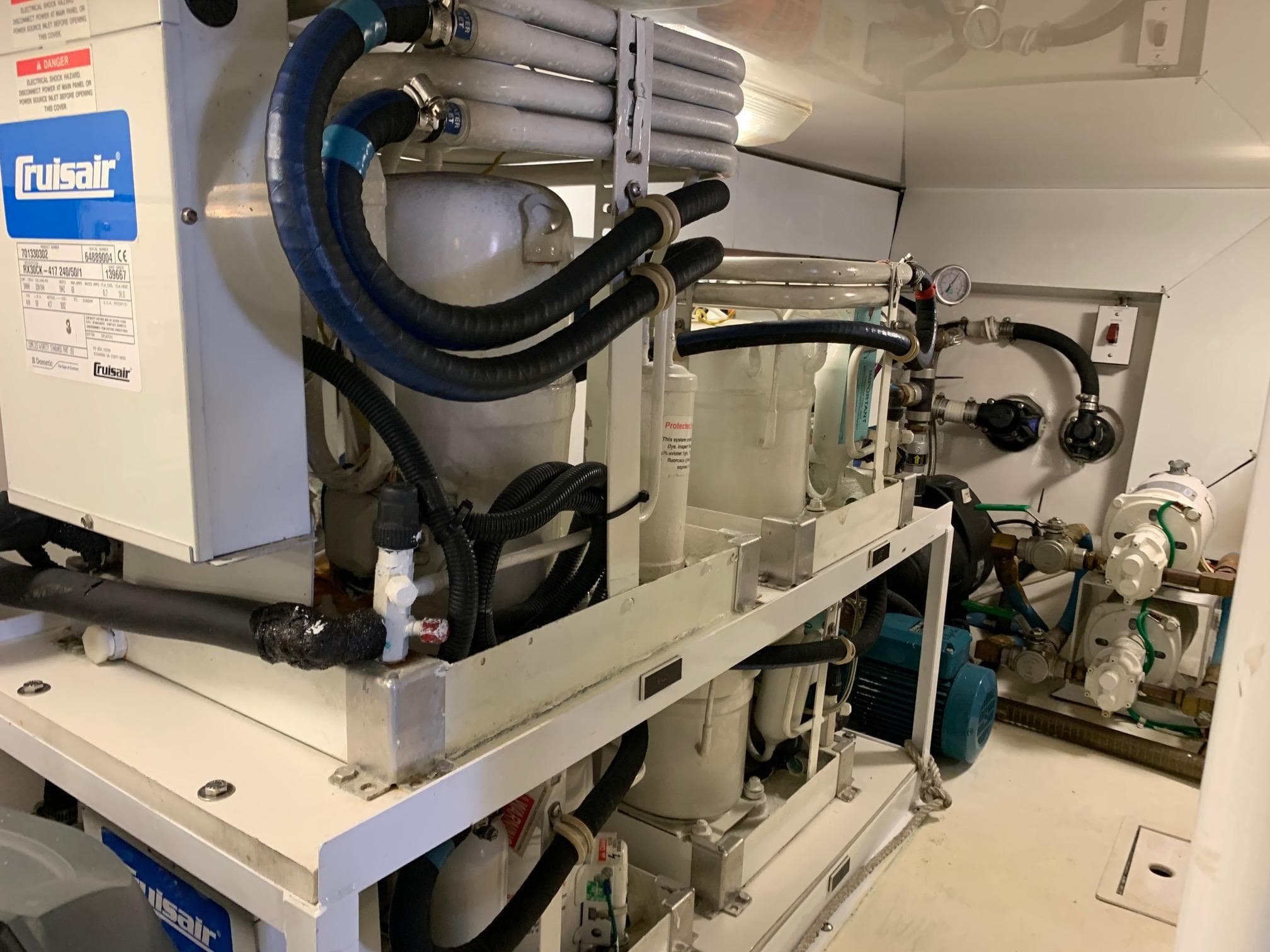 Engine room of a 2007 Viking 52 yacht with Cruisair equipment.