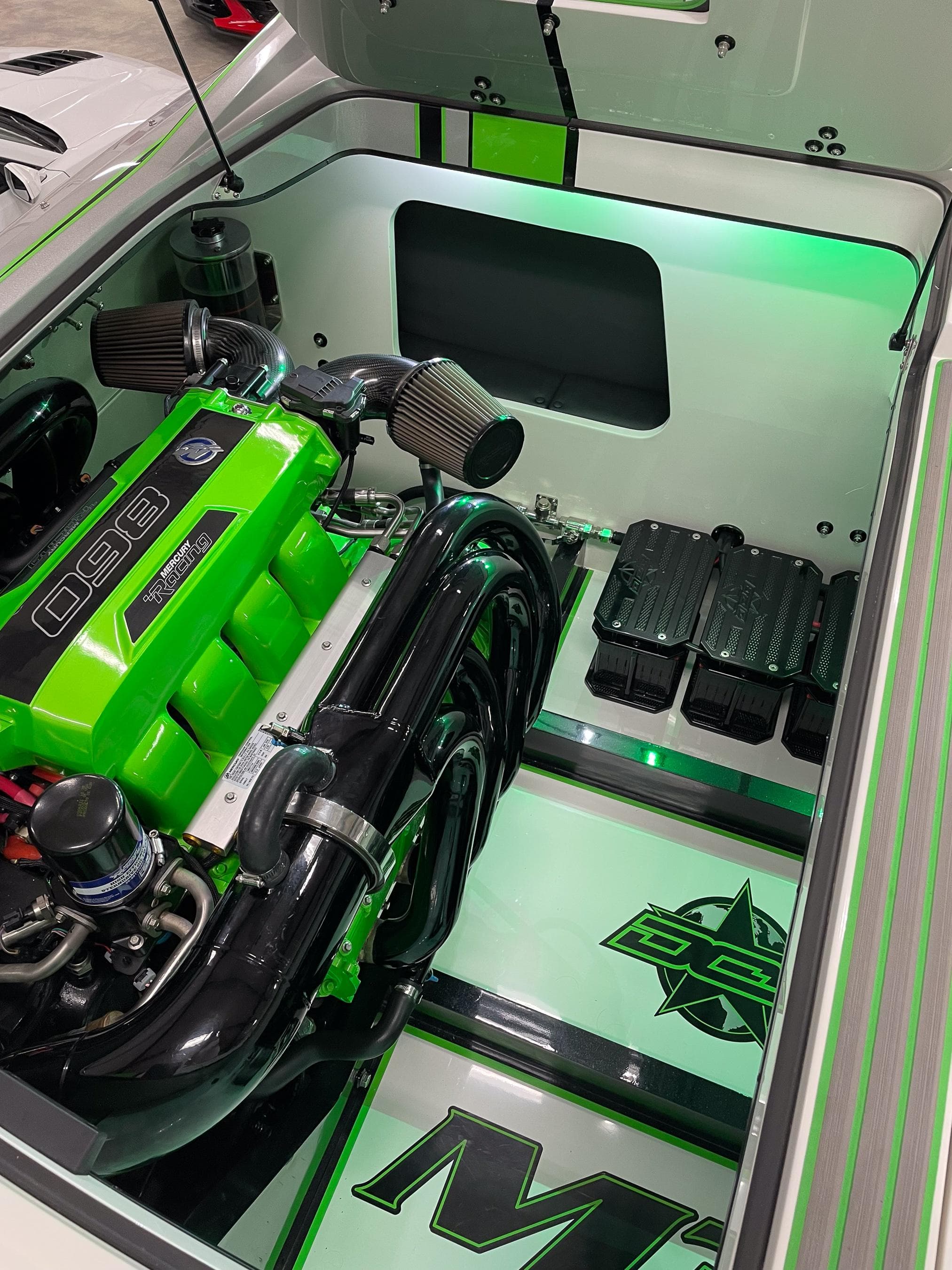 2018 Daves Custom Boats M31 engine compartment with vibrant green accents and sleek design.