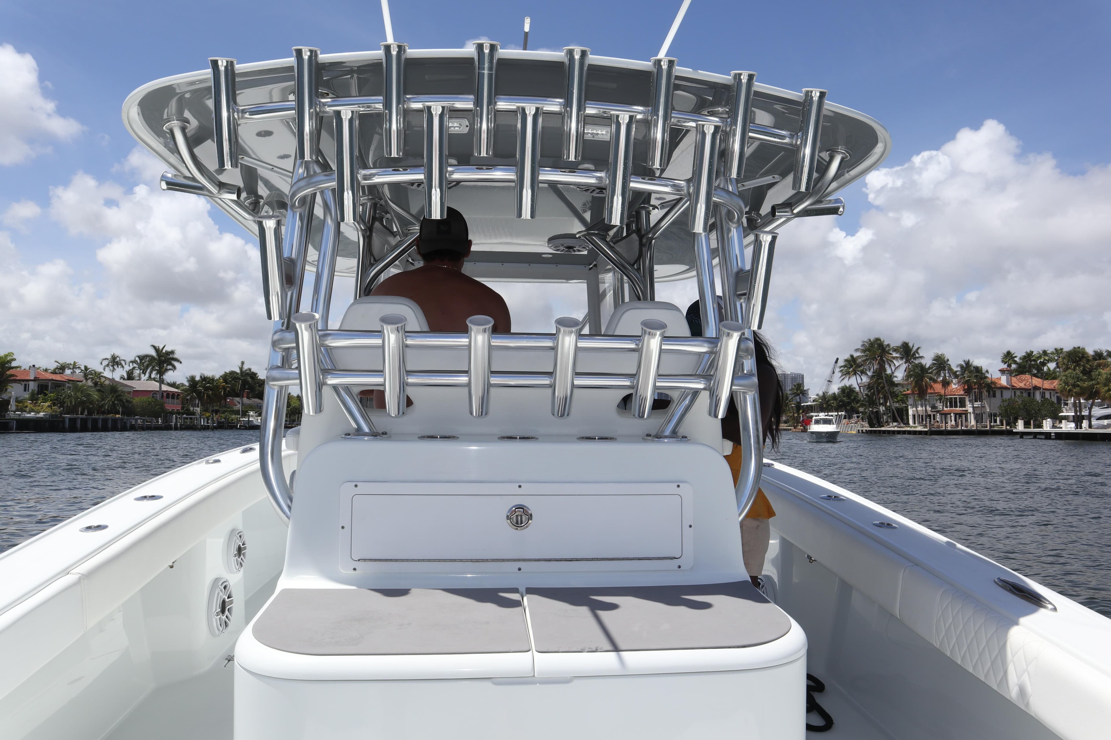 2022 Freeman 34VH boat on water, featuring sleek design and rod holders.