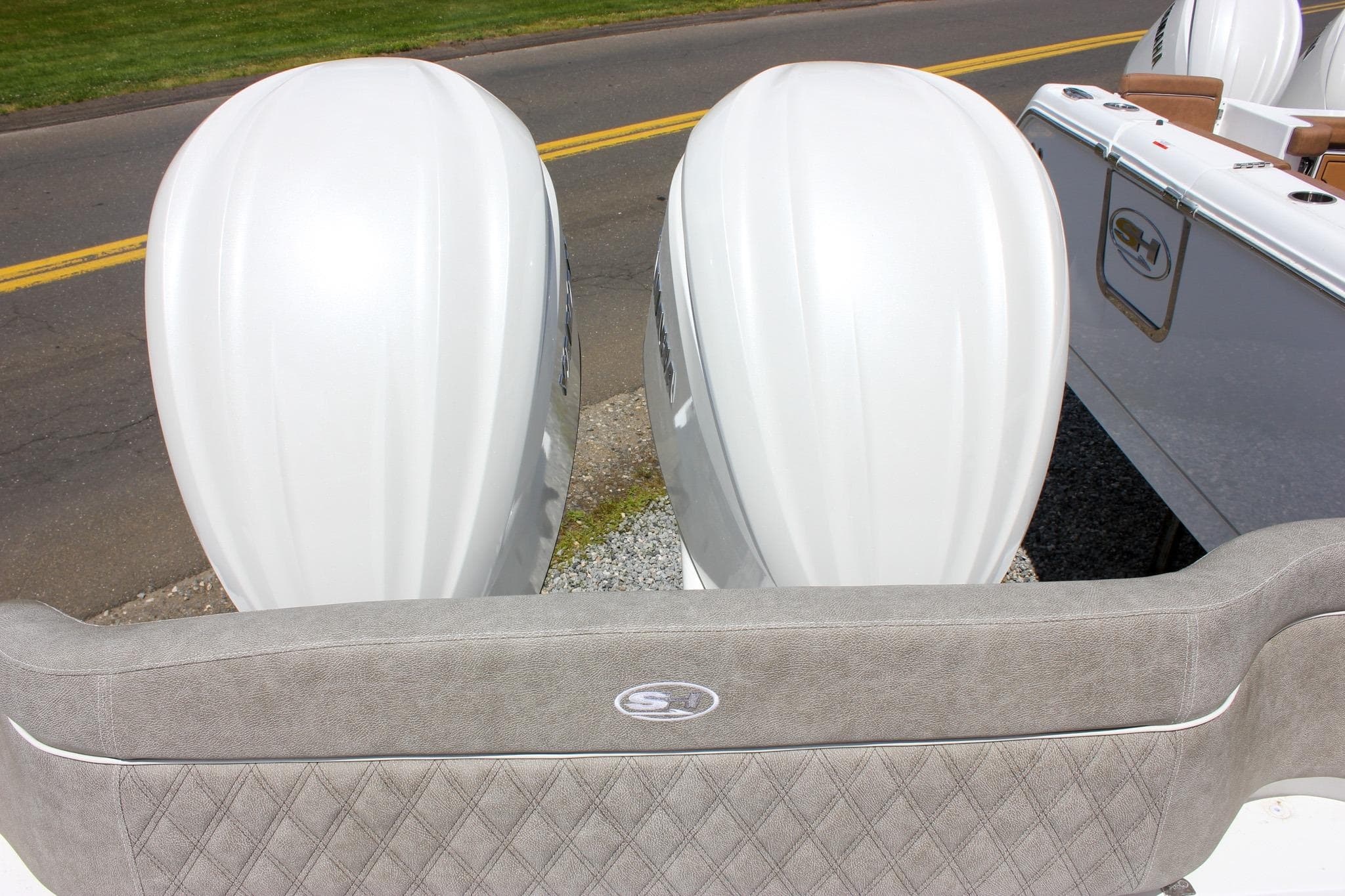 2027 Sea Hunt Ultra 275 Coffin Box with dual outboard motors, rear seating view.