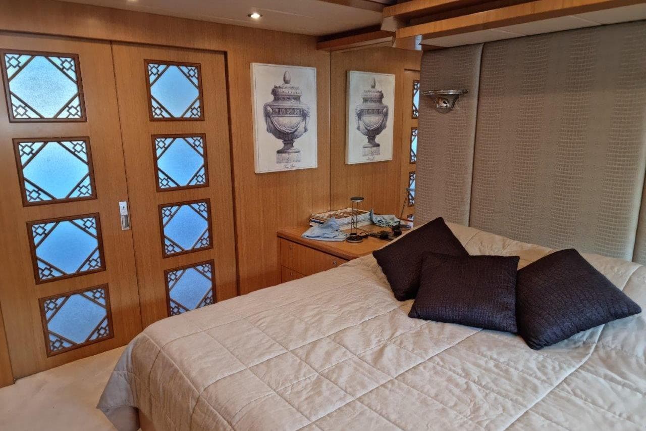 Luxurious bedroom interior on 2008 Bandido 75 yacht with elegant decor and soft lighting.