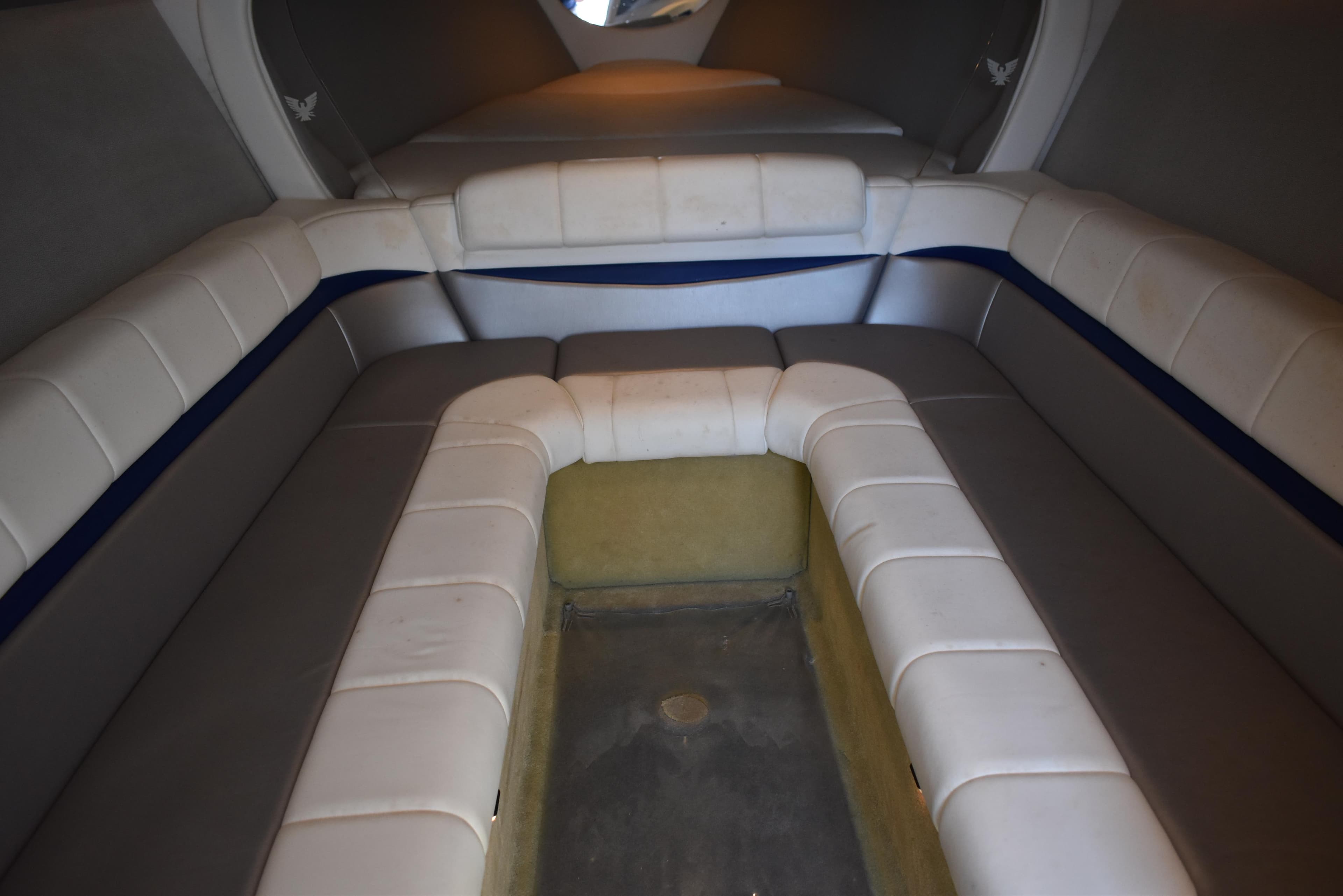 2008 Formula 353 FASTech cabin interior with white seating and blue accents.