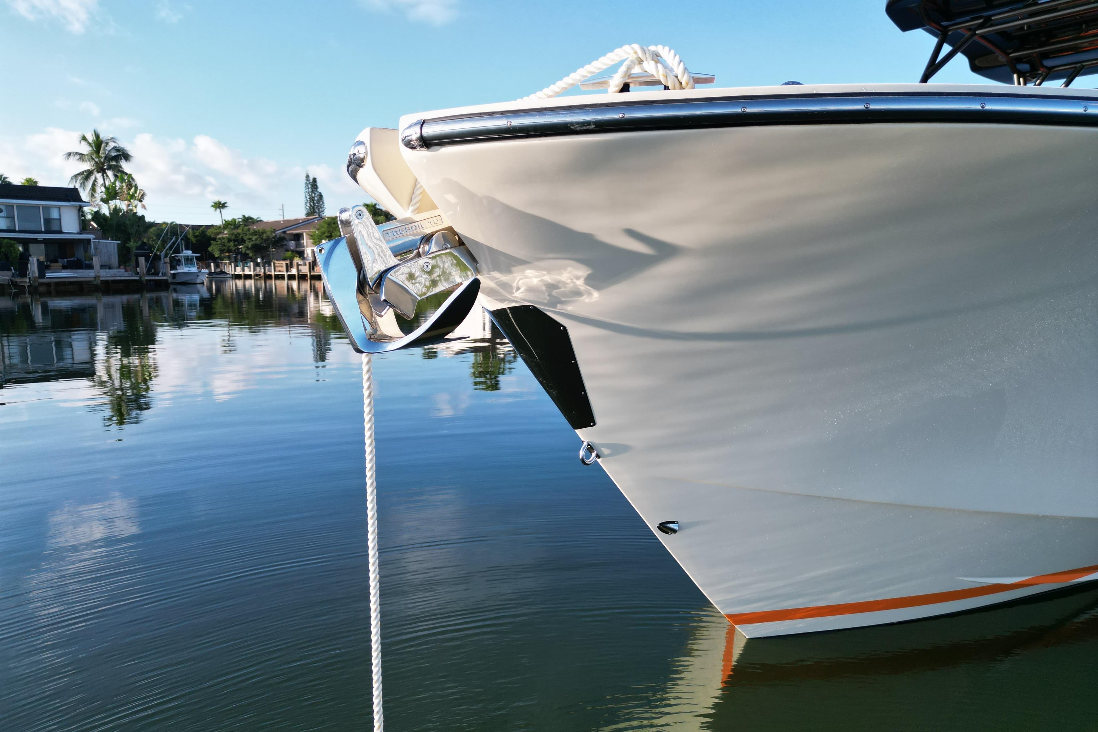 2026 Lilybaeum Lipari 31 yacht anchored in serene waters, reflecting a clear blue sky.