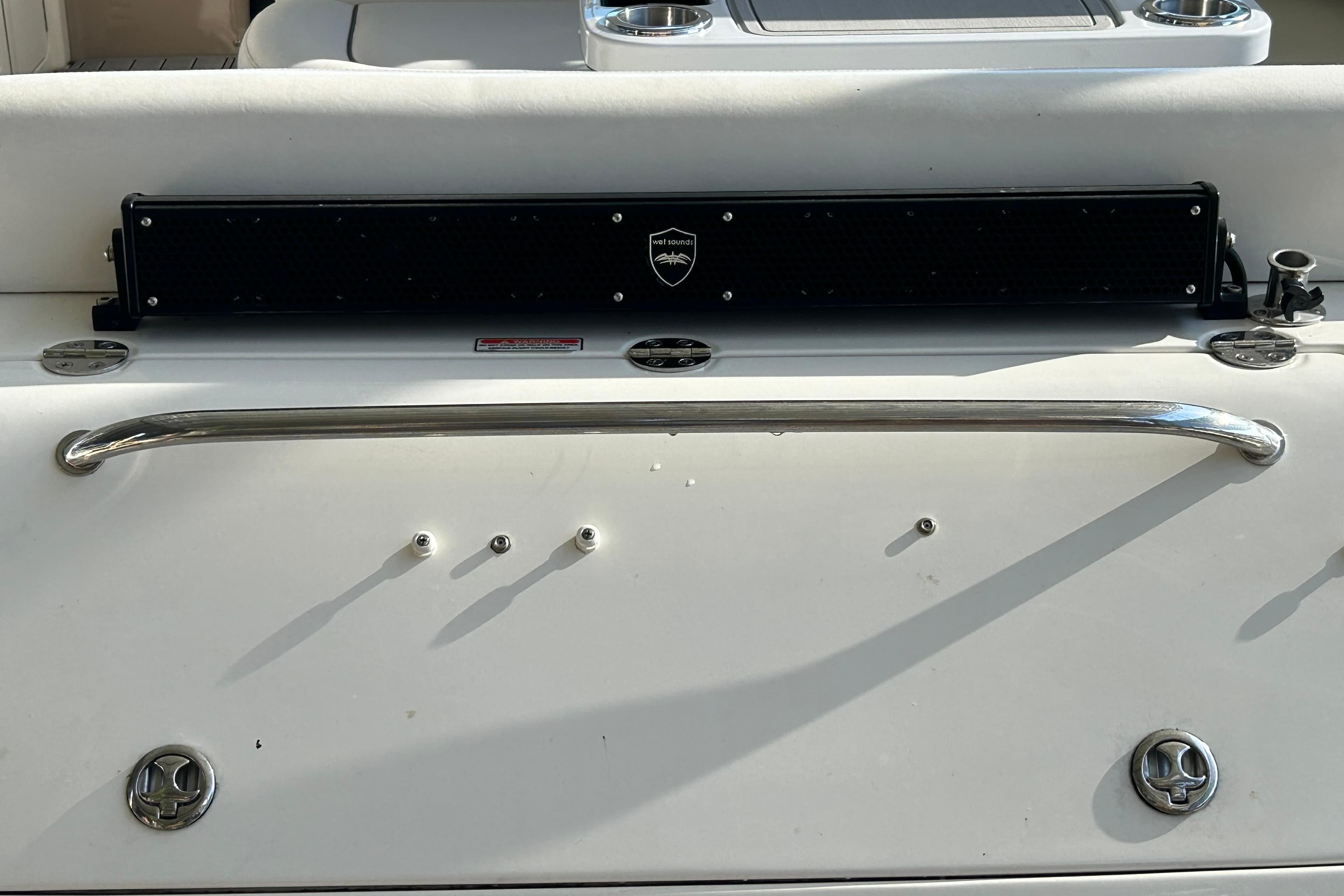 2004 Sea Ray 360 Sundancer boat deck with stainless steel rail and speaker system.