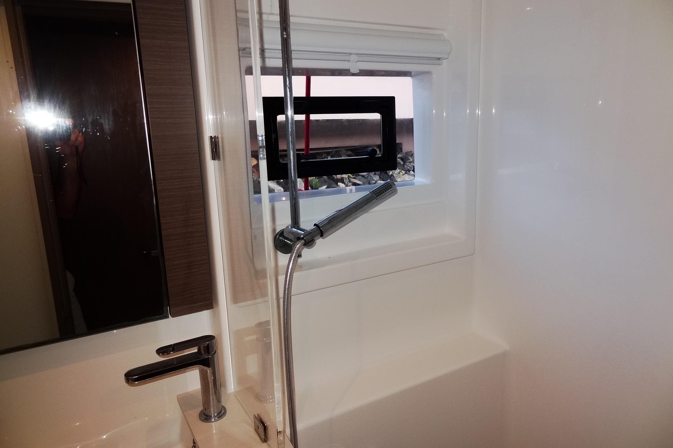 2024 Robertson and Caine Leopard 42 yacht bathroom with modern fixtures and window.